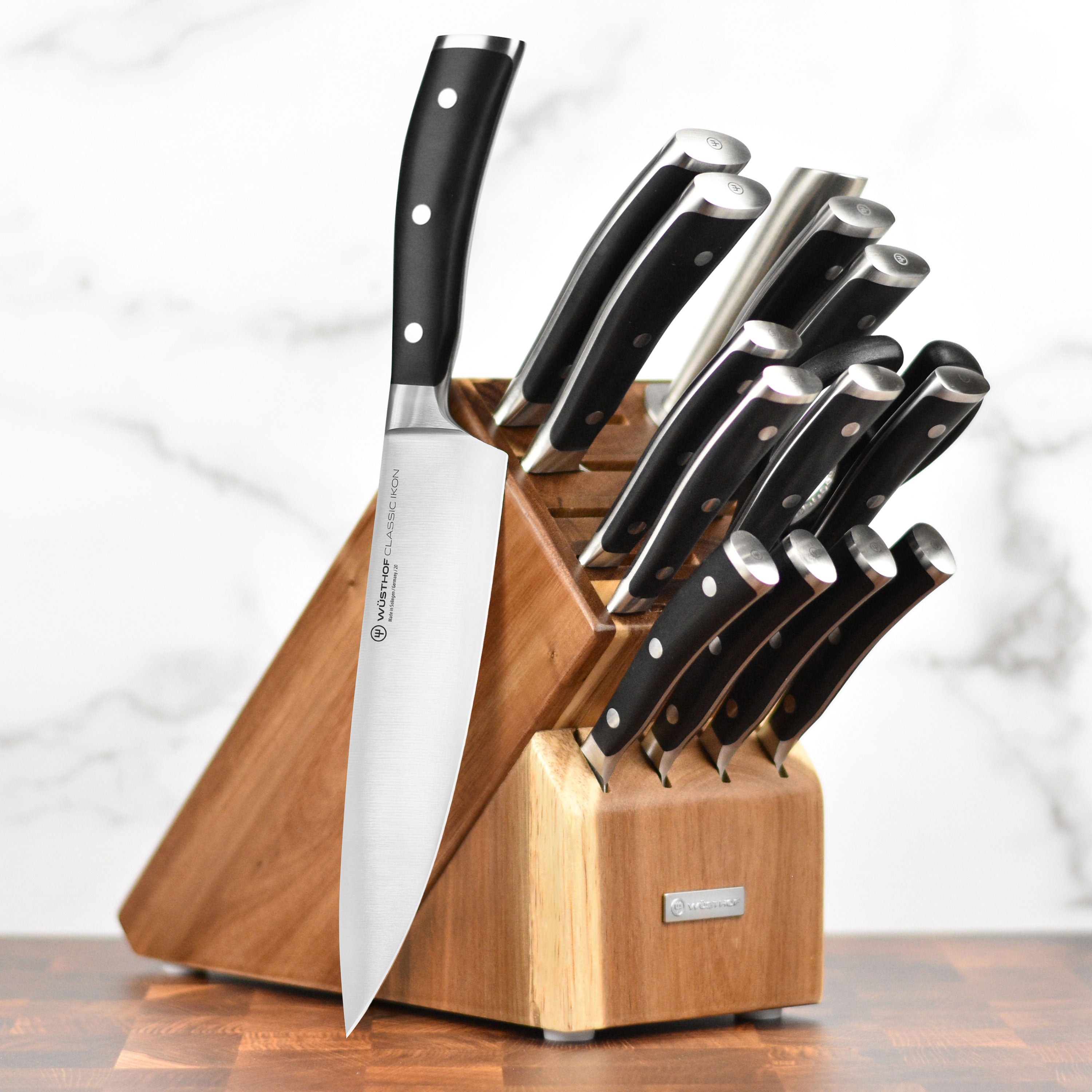 Wusthof Classic Ikon knife set displayed in a stylish acacia block, showcasing elegant design and premium craftsmanship.