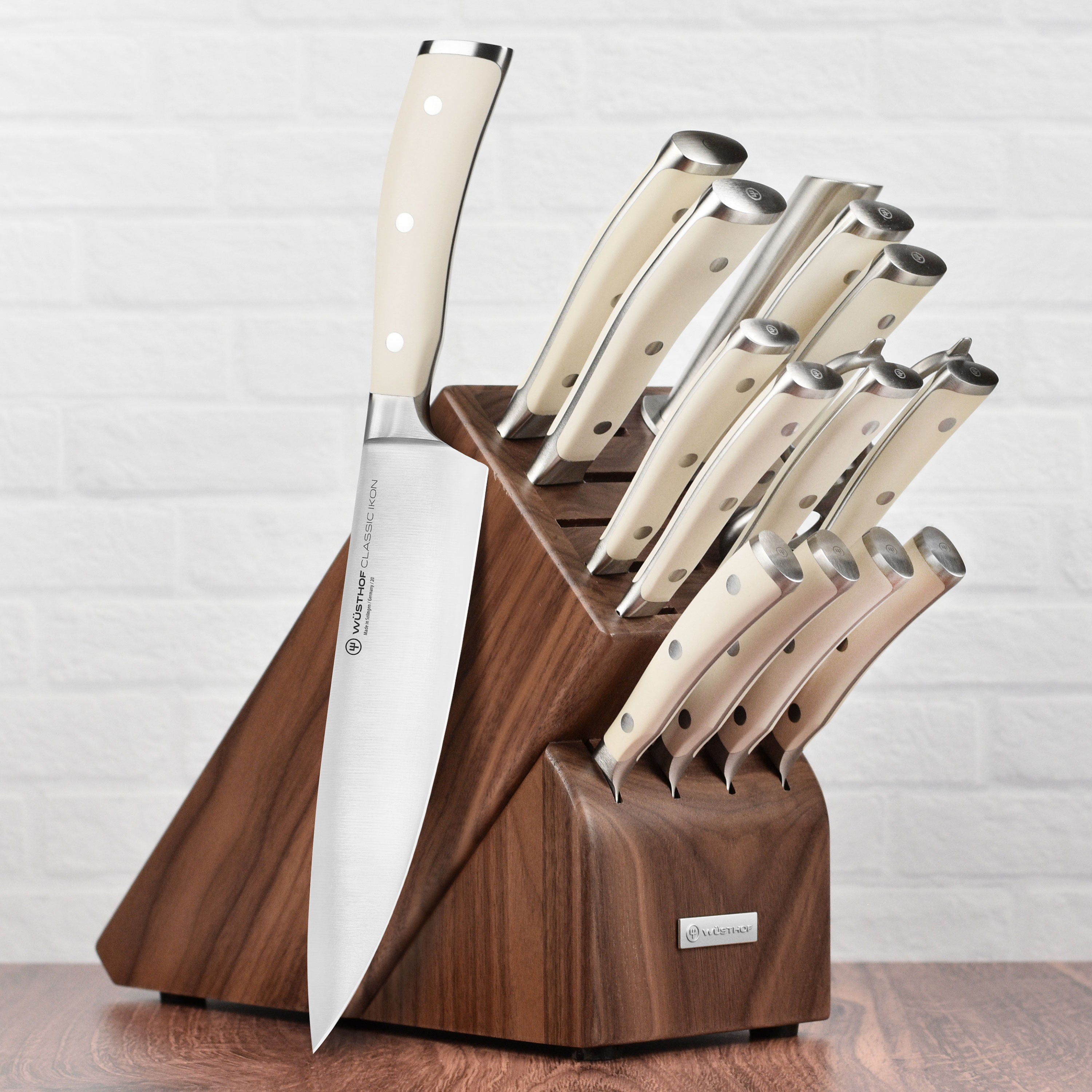 Wüsthof knives in a walnut knife block on a modern kitchen countertop