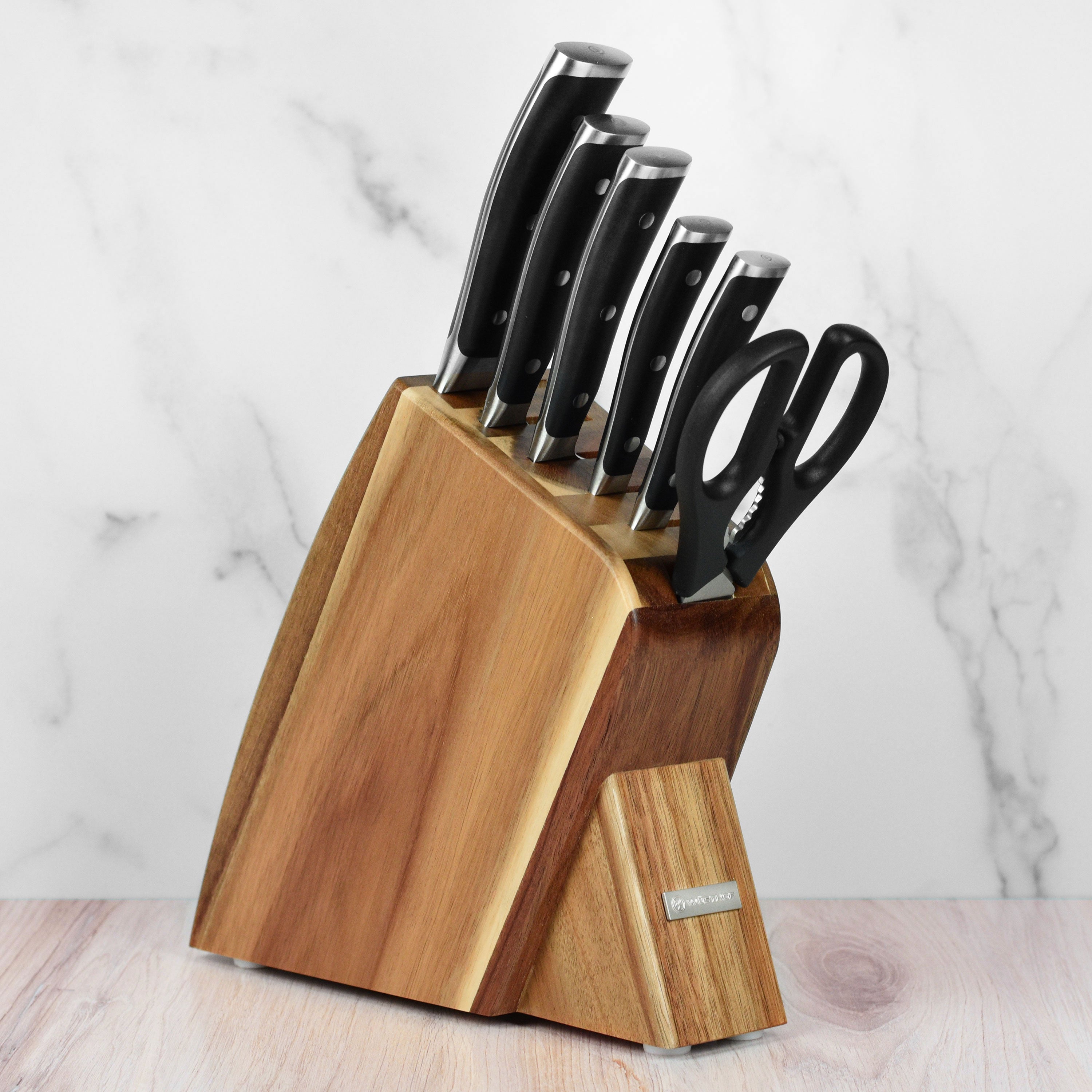 Wusthof Classic Ikon knife set displayed in an acacia wood block, showcasing the sleek design and sharp blades.