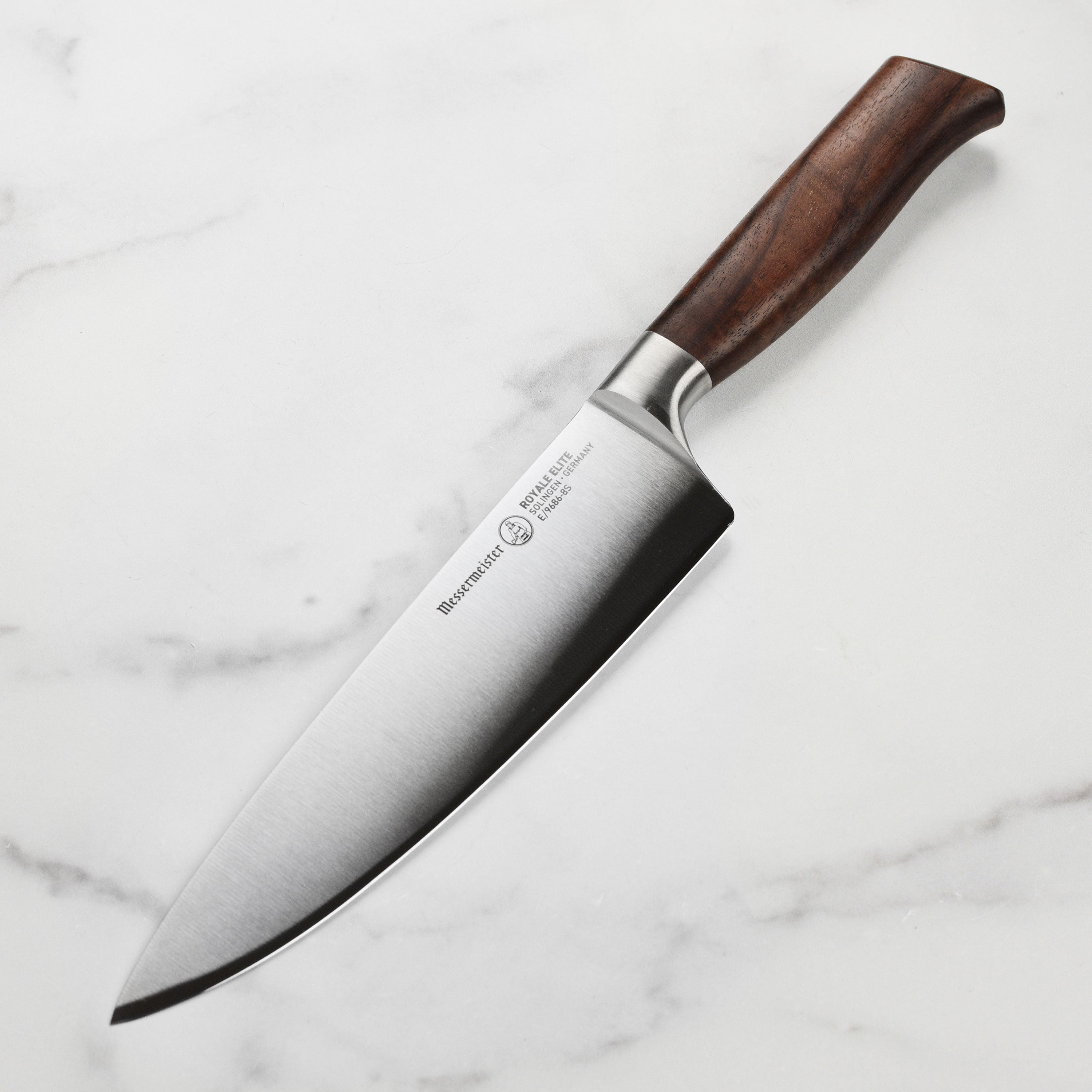 Side view of the Royale Elite chef’s knife showing the full-length German knife blade and walnut handle.