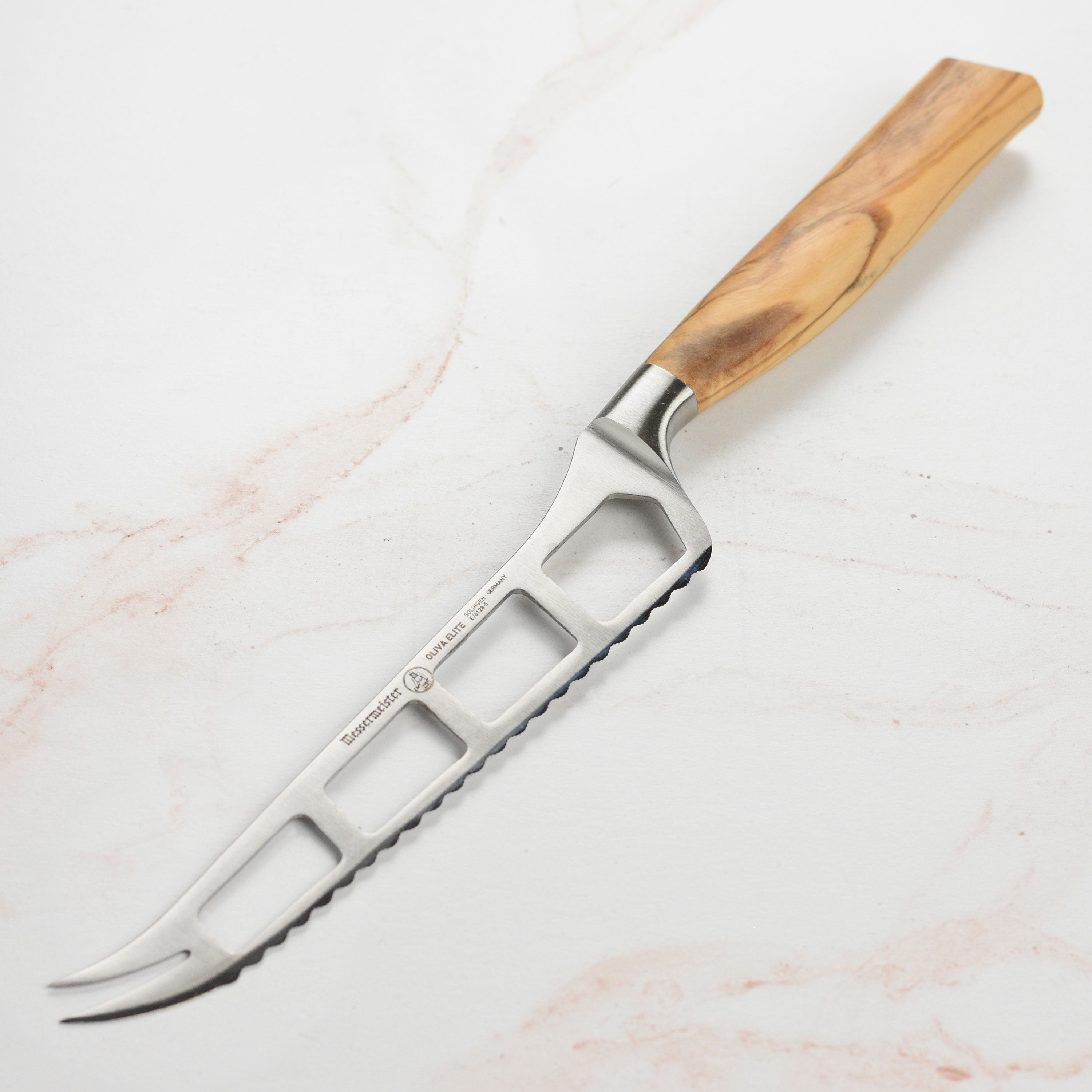Oliva Elite gourmet cheese knife with ergonomic handle for easy slicing.