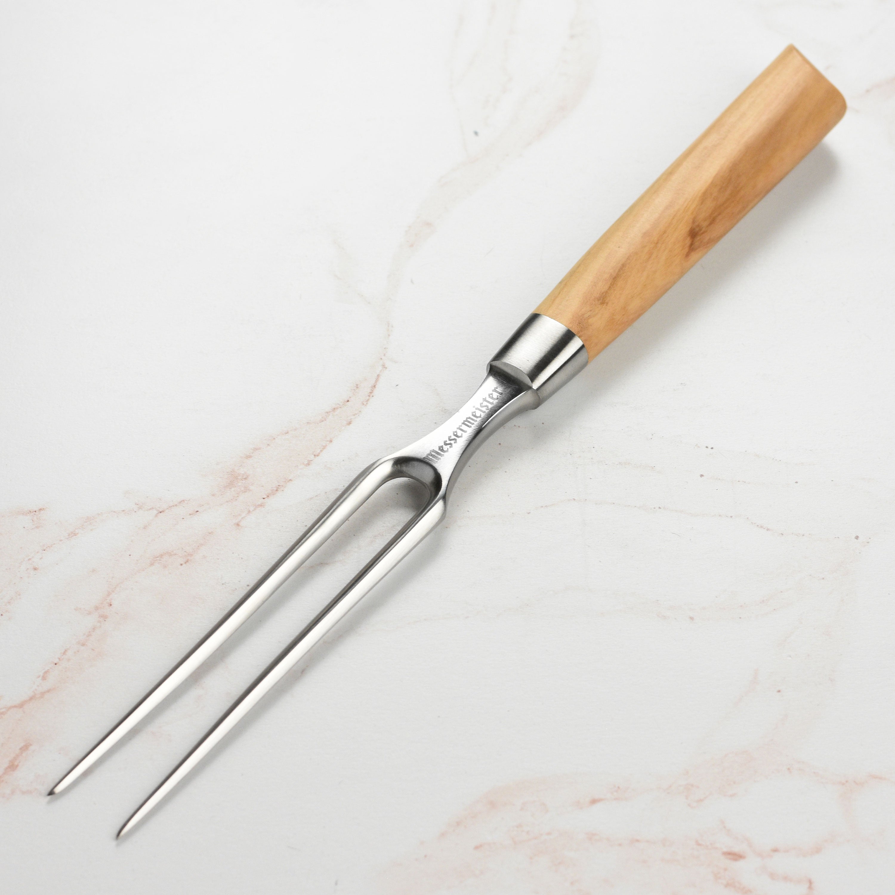 Close-up of the Messermeister Oliva Elite carving fork with olive wood handle