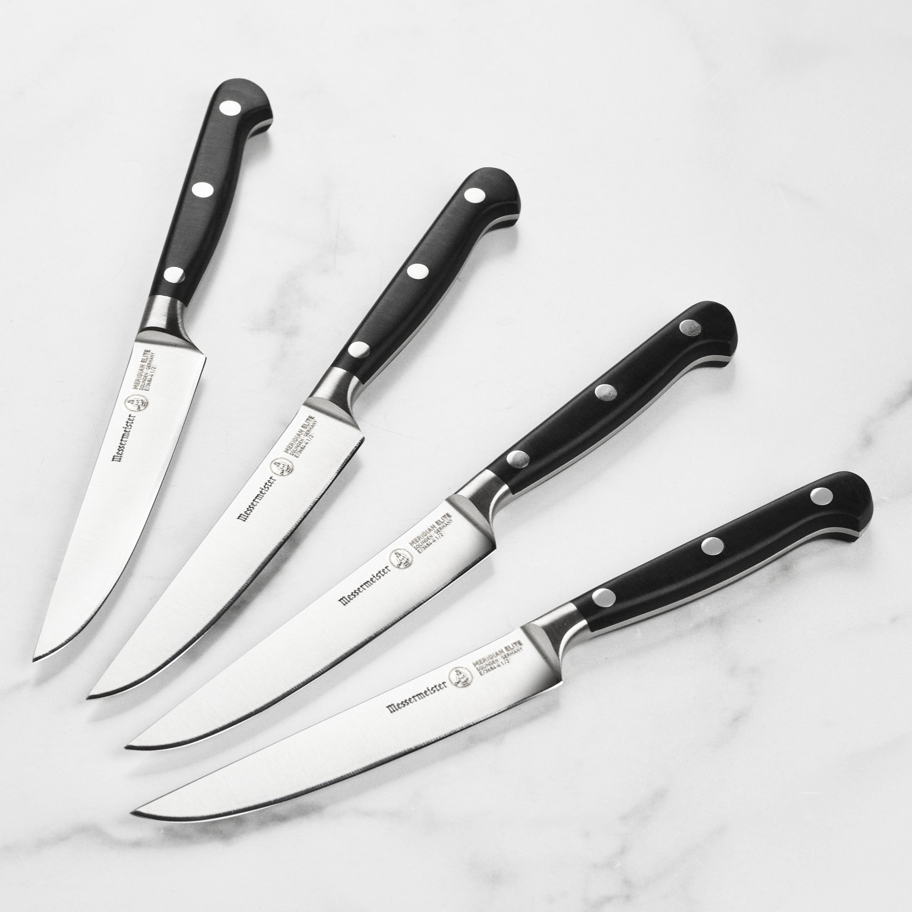 Close-up of Meridian Elite steak knife blade showing polished edge and German craftsmanship