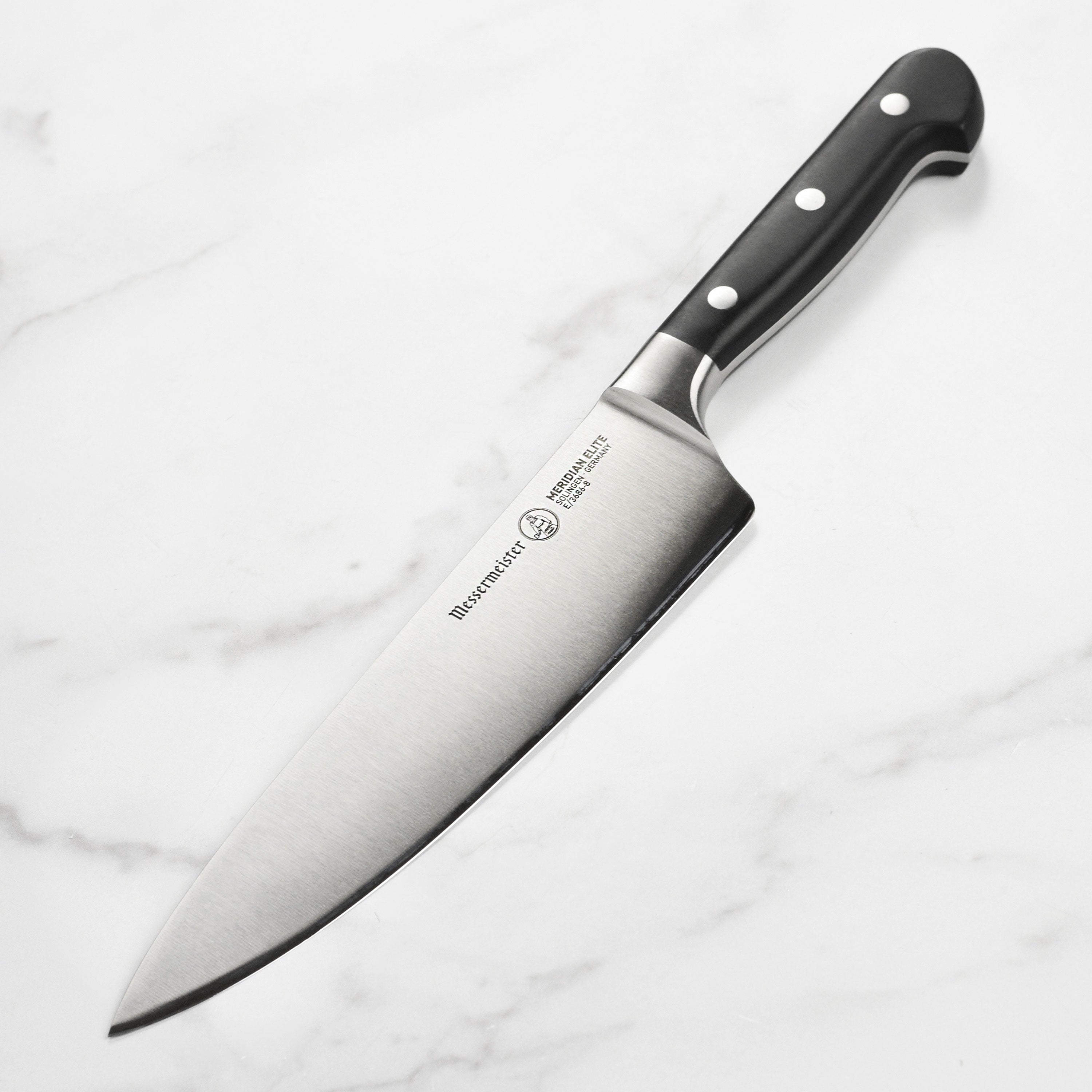 Close-up of Messermeister Meridian Elite 8-inch chef's knife blade showing sharp edge