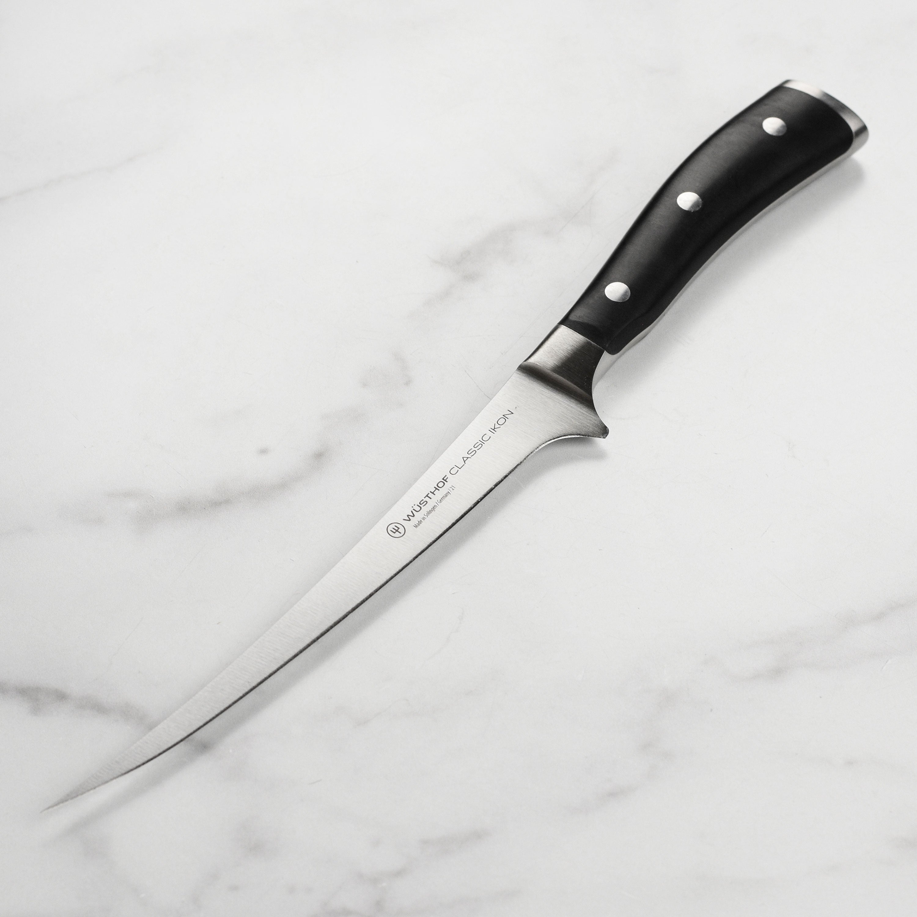 Wusthof Classic Ikon fish fillet knife showing the flexible blade for filleting fish.