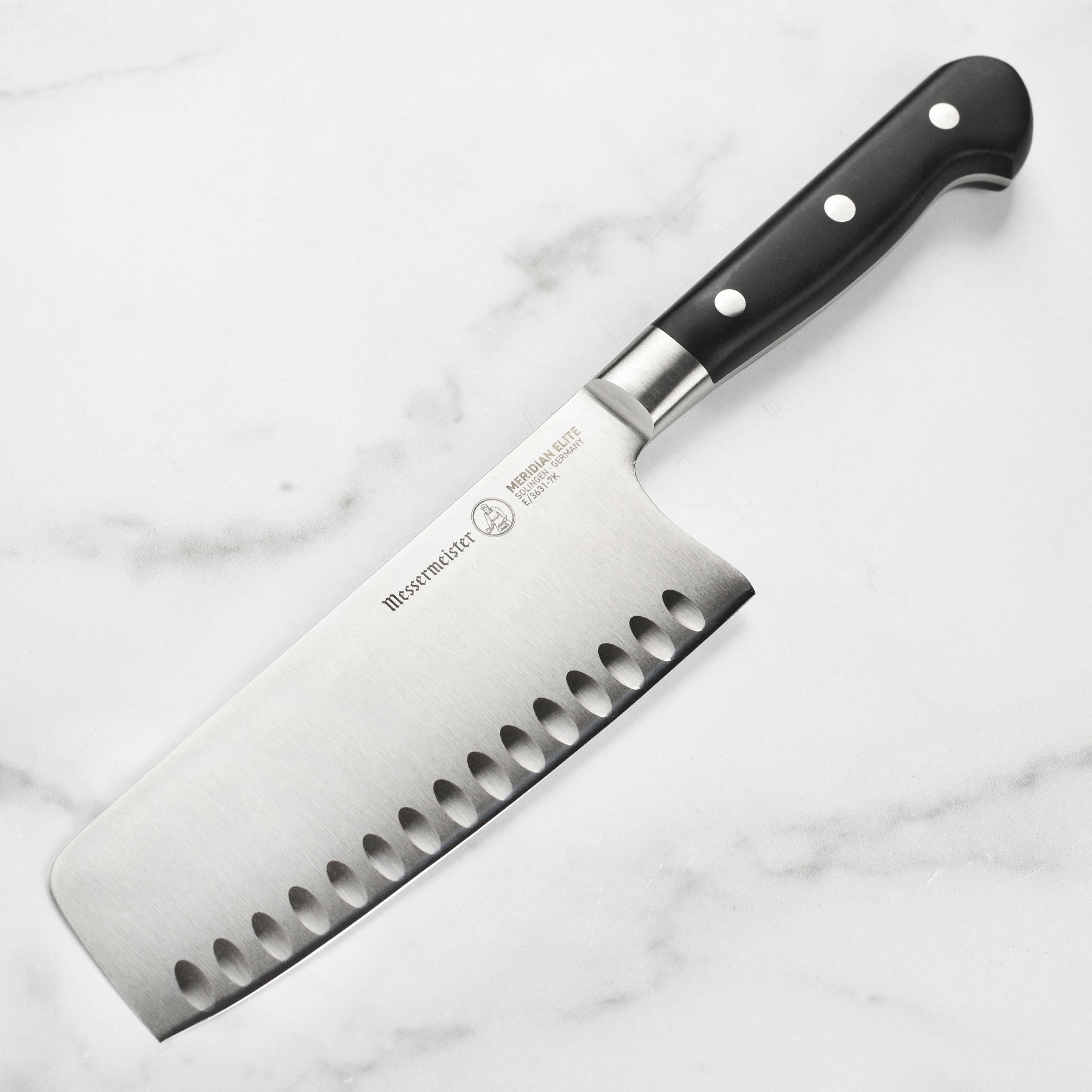 Close-up view of the Elite Nakiri Vegetable Knife blade highlighting its sharpness and stainless steel finish.