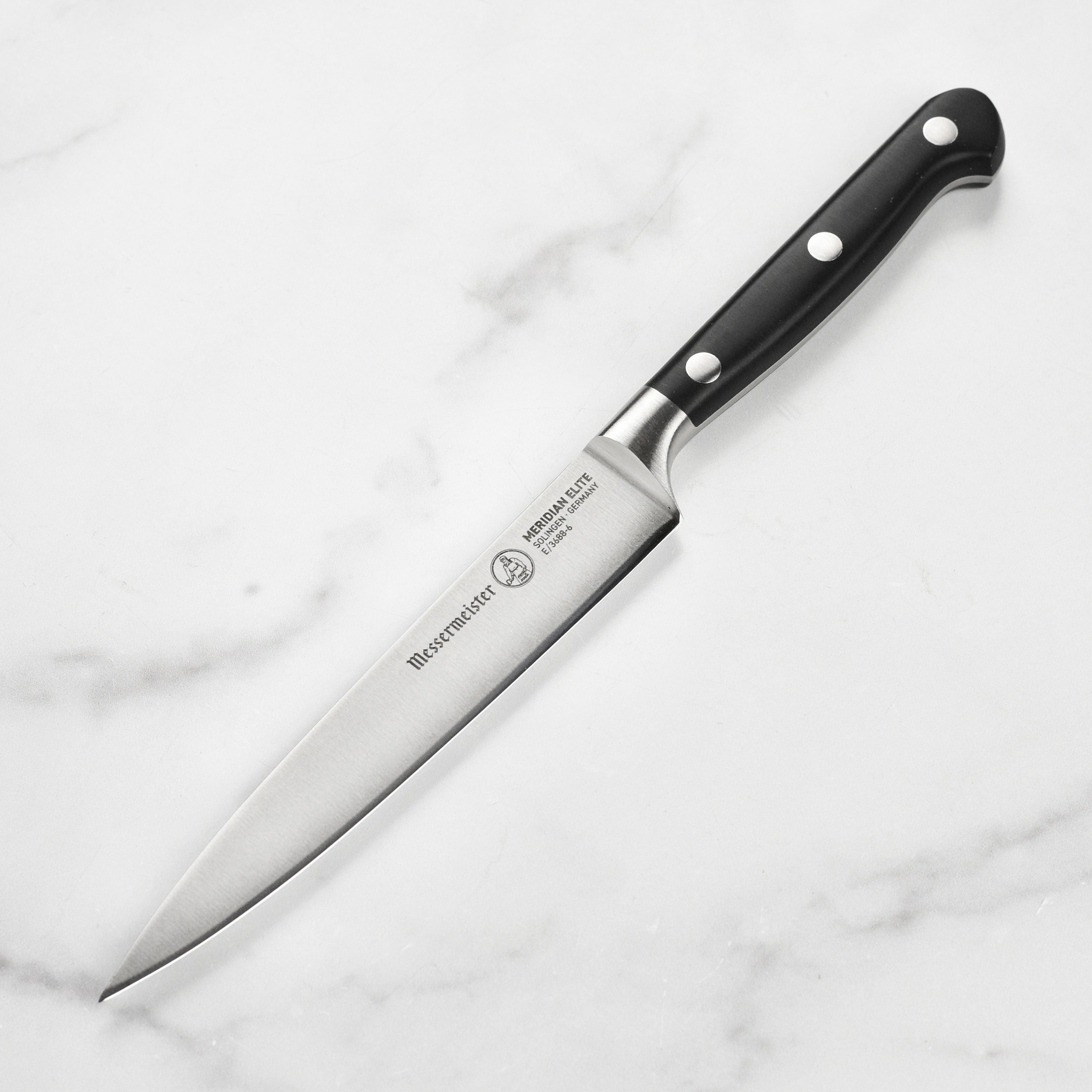 Close-up of Messermeister Meridian Elite 6-inch utility knife blade showing its sharp edge