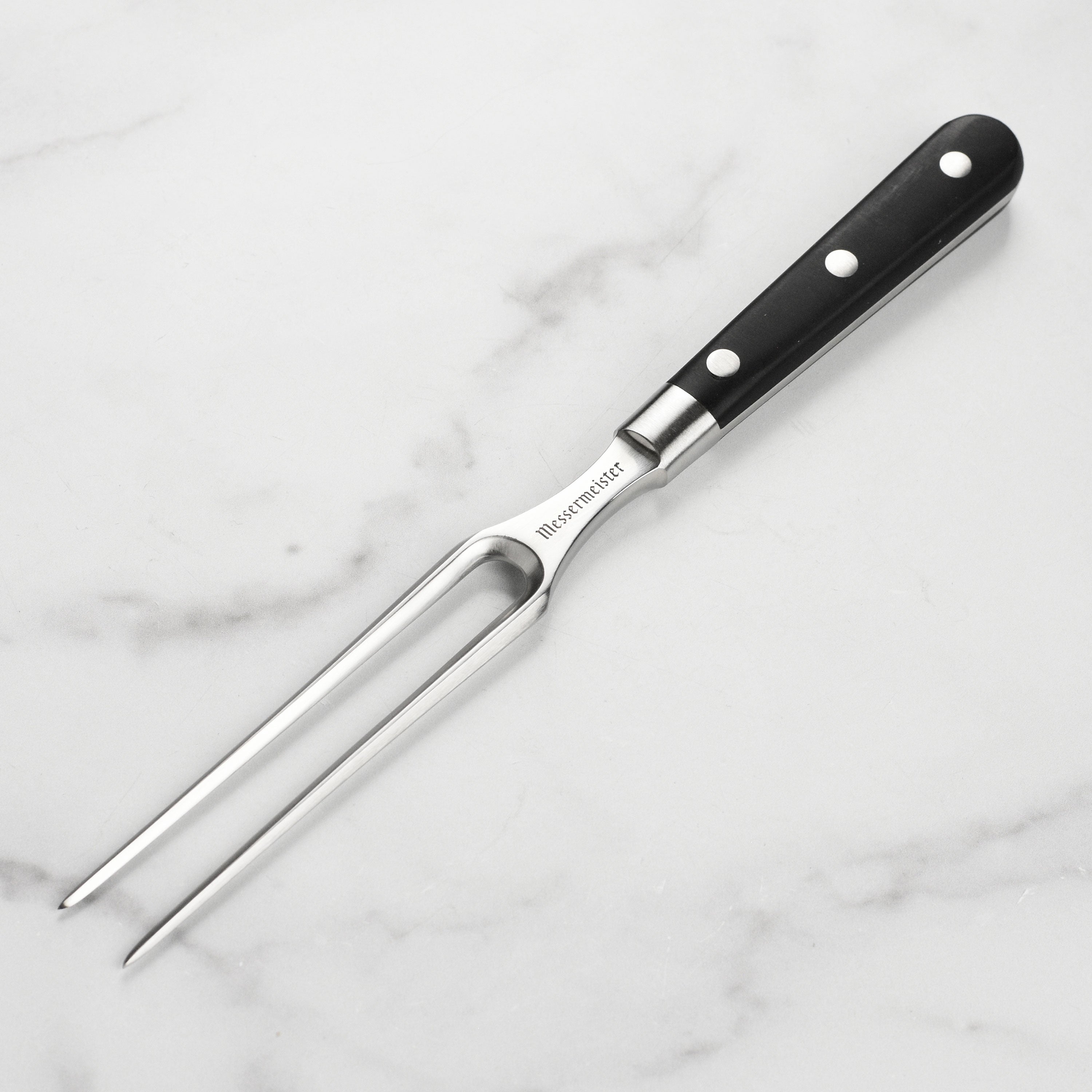Close-up of the Meridian Elite 6-Inch Carving Fork showcasing its sharp tines and ergonomic handle.