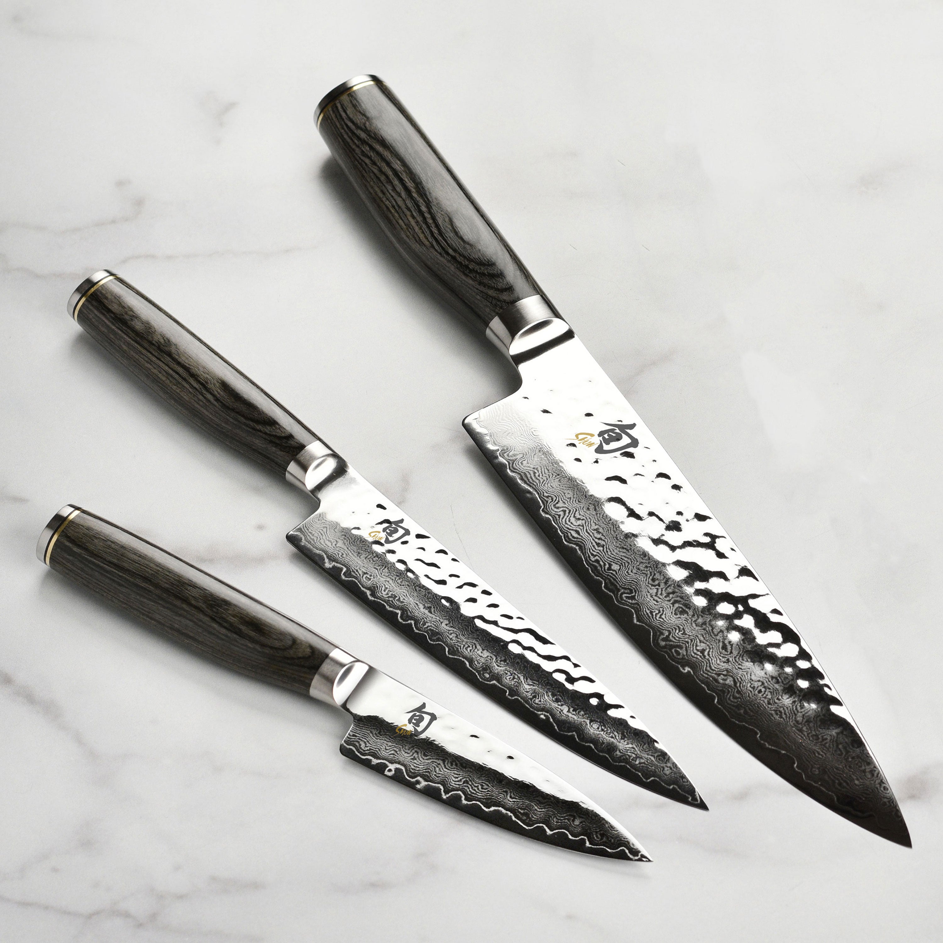 Close-up of the Elite Damascus knife set highlighting the blade's exquisite finish.