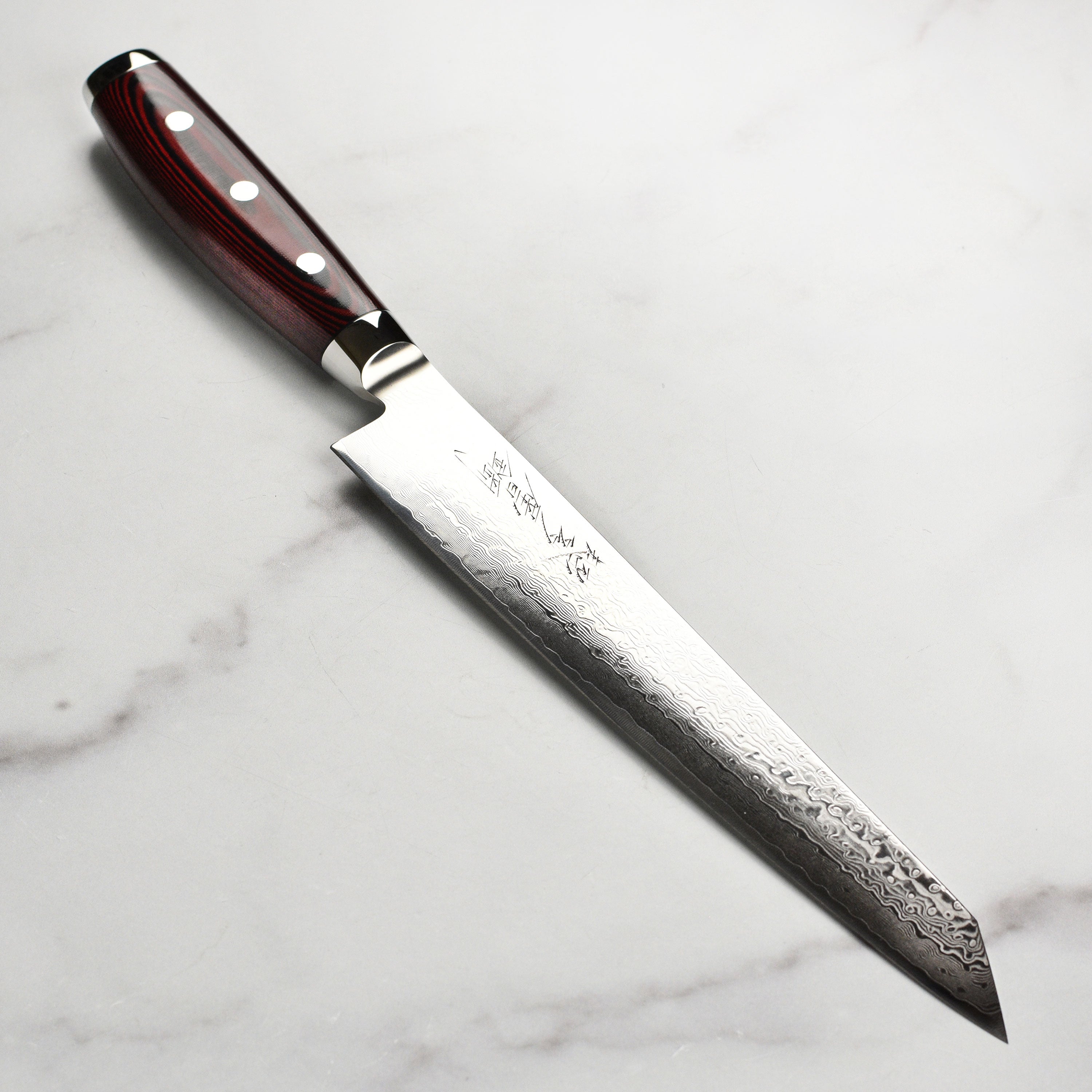 Close-up of the Yaxell Super Gou SG2 slicing knife blade and handle.