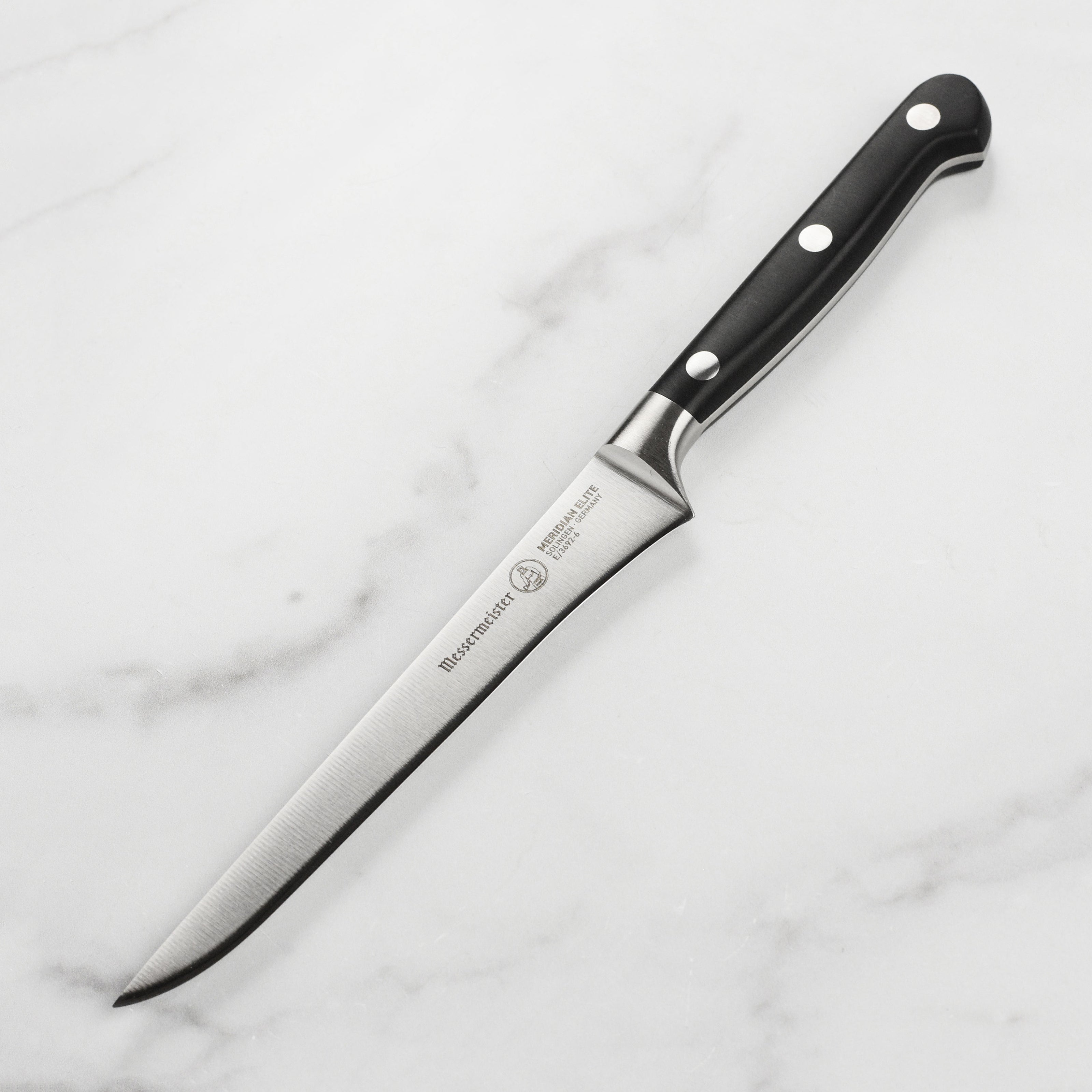 Close-up of the Elite German 6-Inch Boning Knife blade highlighting its sharp edge.