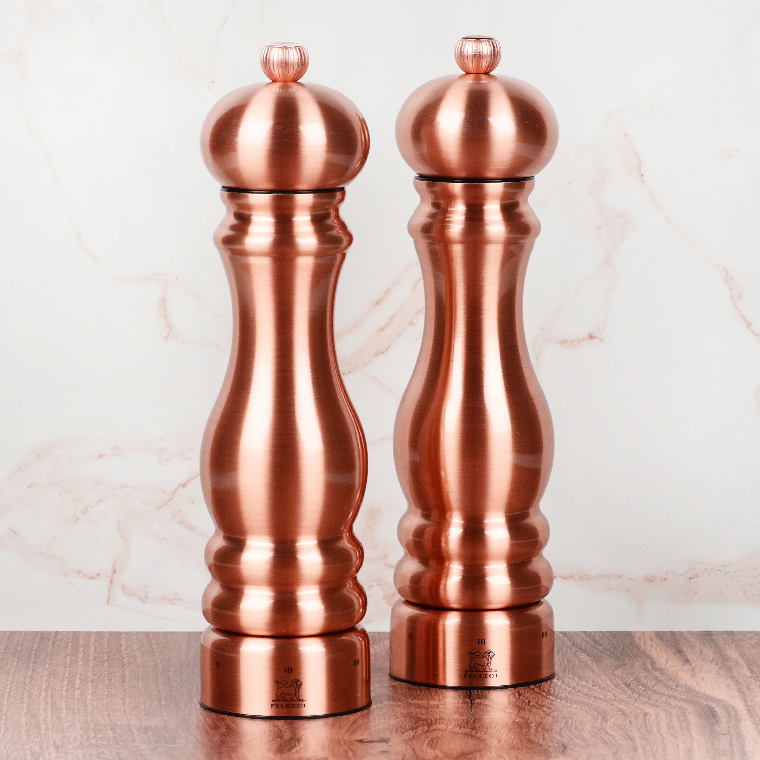 Close-up of Peugeot Paris copper pepper mill showing adjustable uSelect dial
