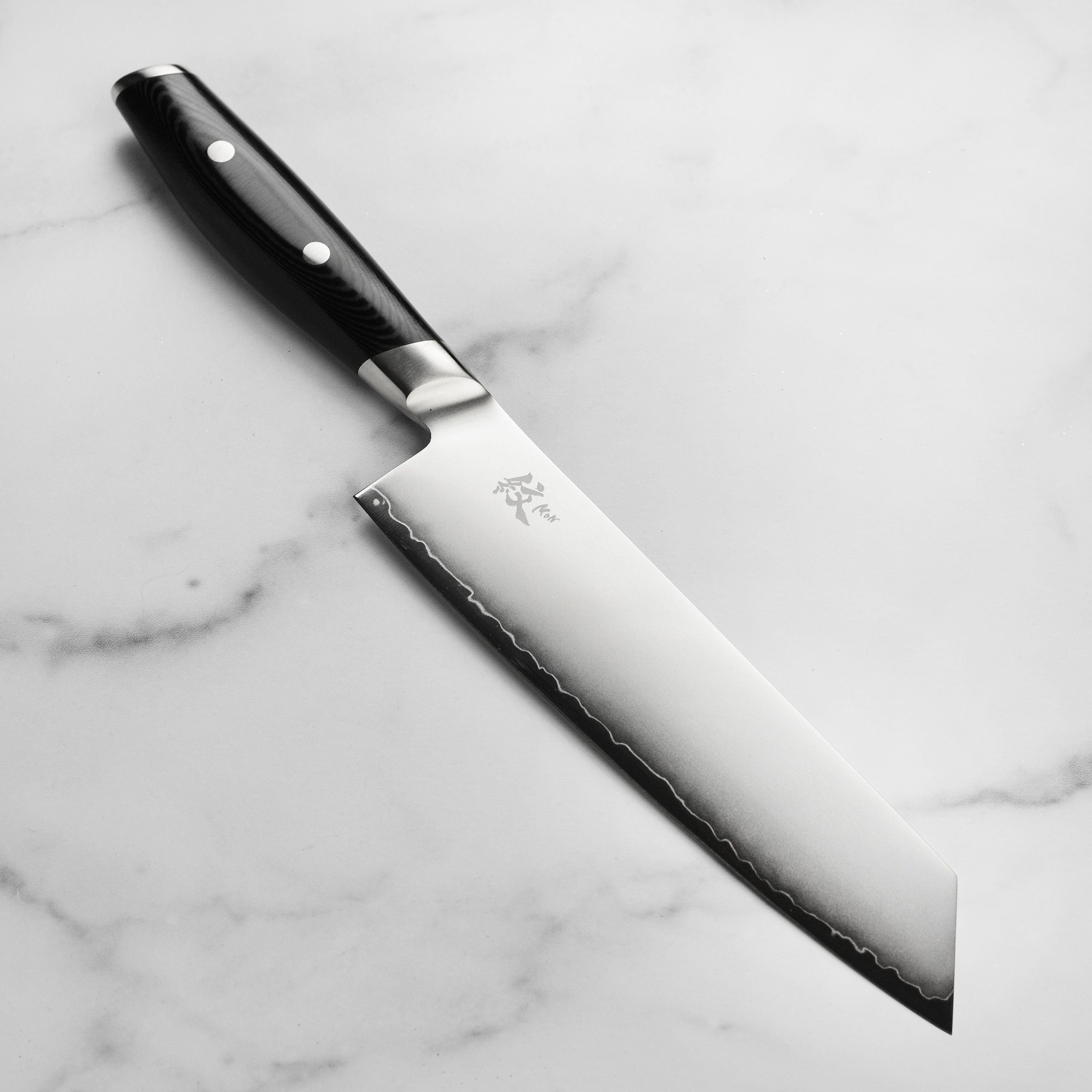 Yaxell Mon Kiritsuke Knife with a sand-blast finish and Katana wave line.