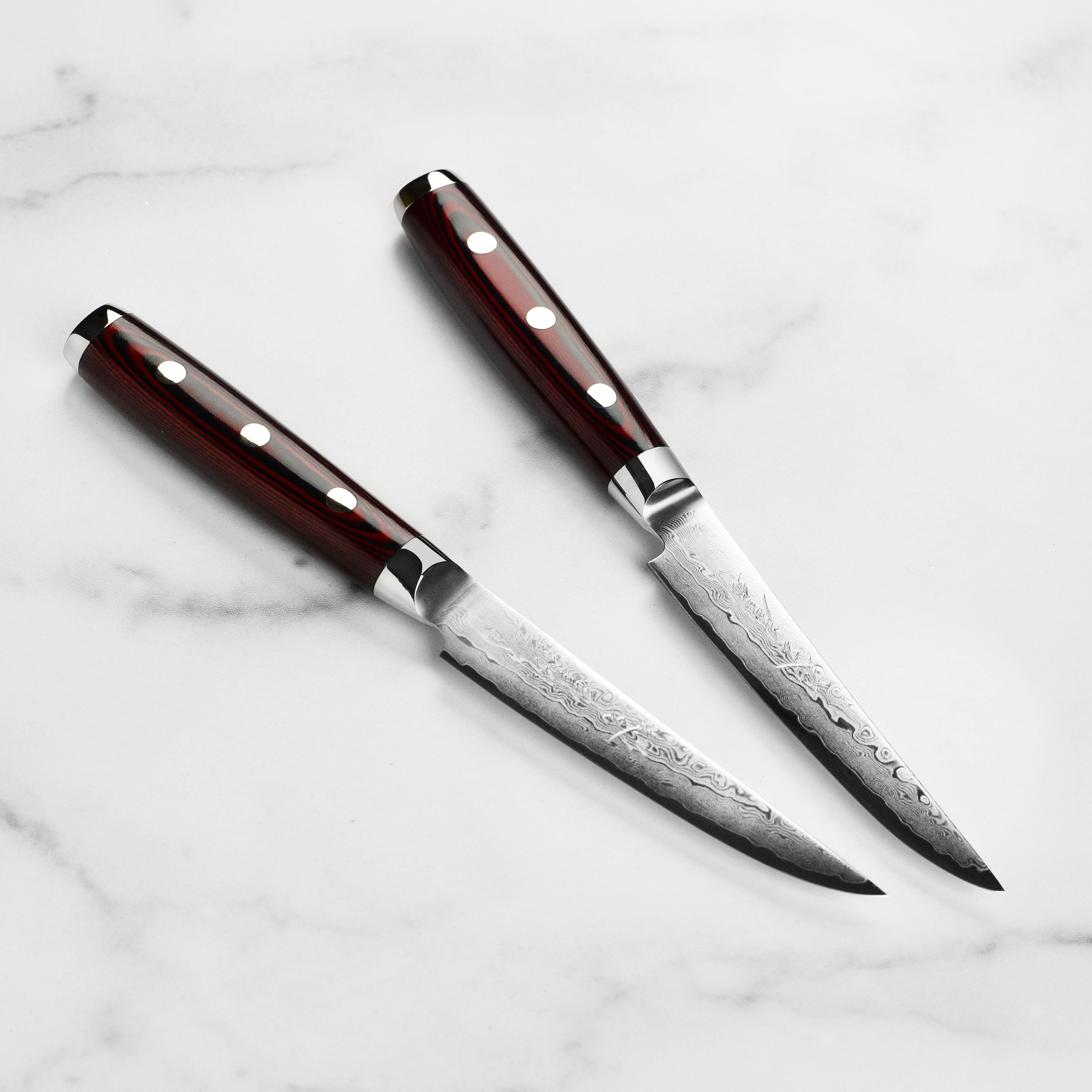 Close-up of the Yaxell Super Gou SG2 steak knife highlighting the blade's craftsmanship.