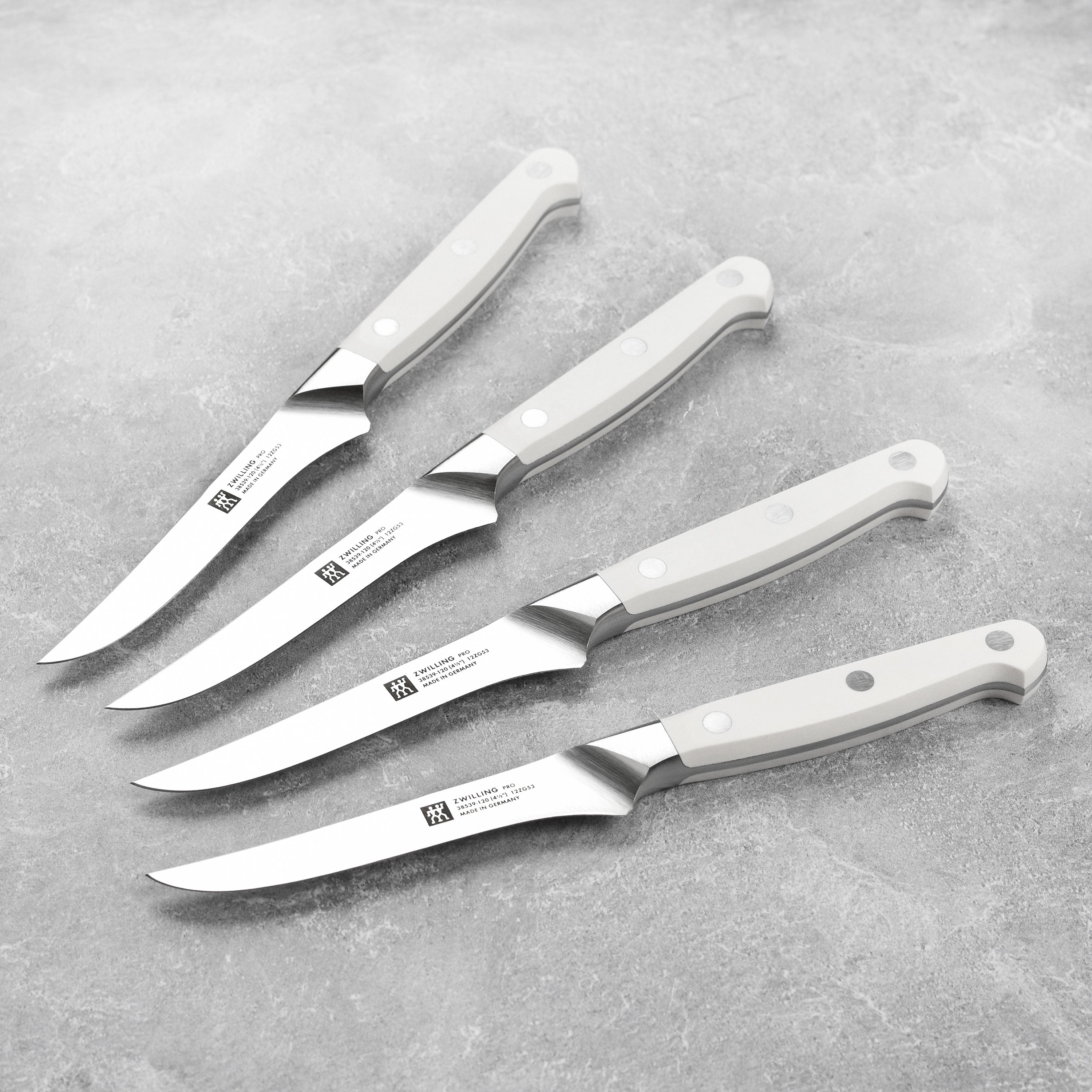 Close-up of Zwilling Pro Le Blanc steak knives with high carbon stainless steel blades