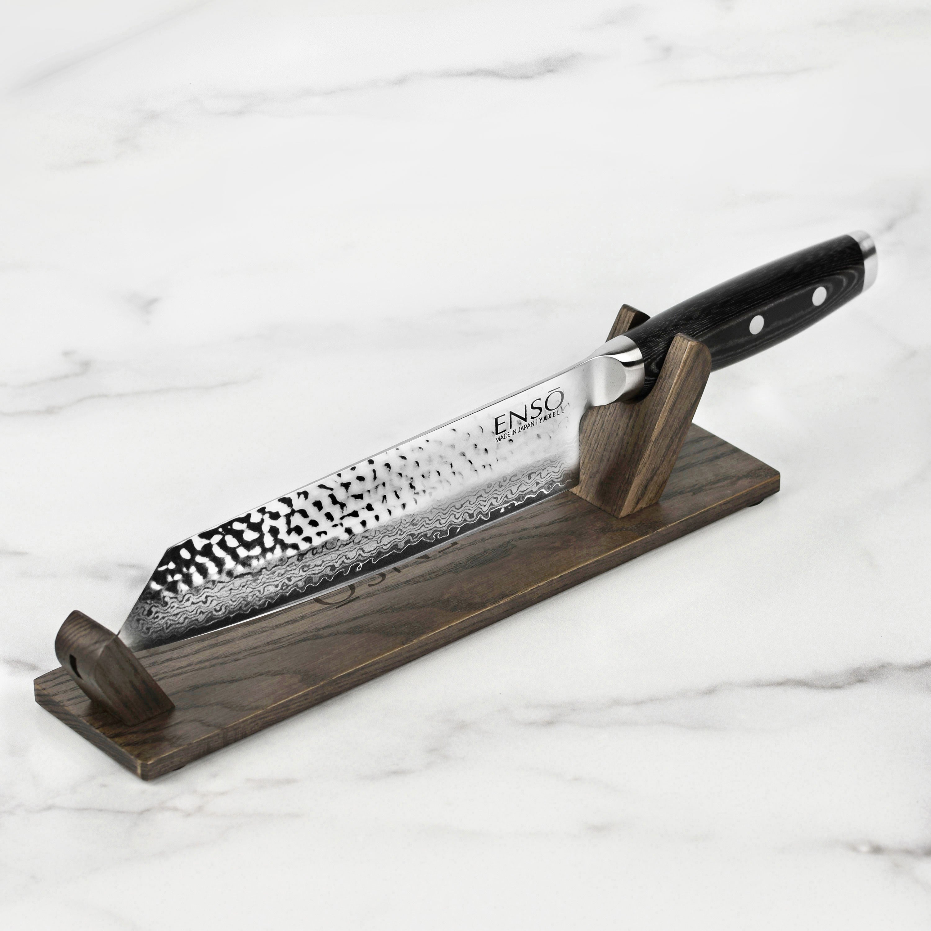 Premium Kiritsuke knife showcasing its Damascus blade and ergonomic handle.