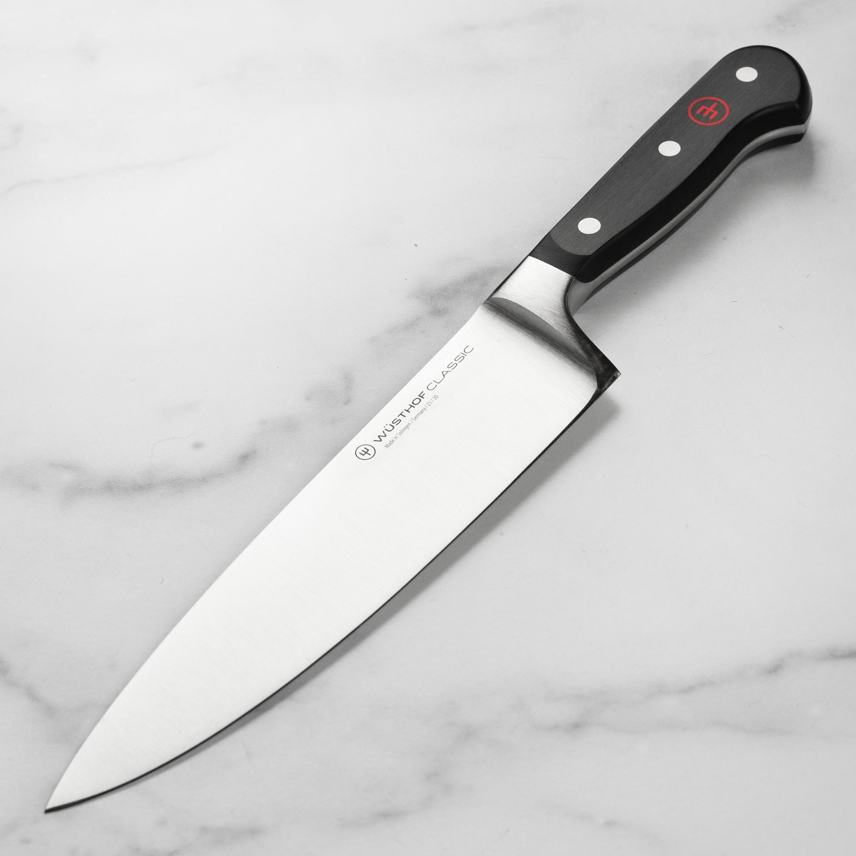 Wusthof Classic 8-Inch Chef's Knife with a focus on the sharp blade
