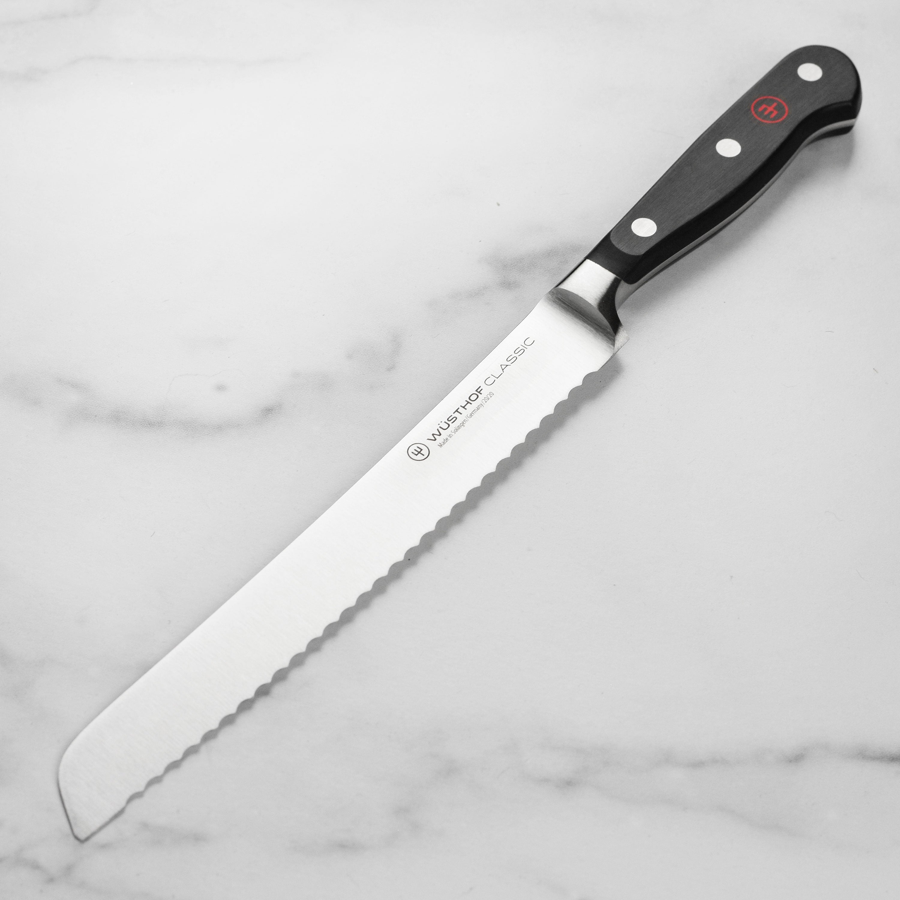 Side view of the Wusthof Classic 8-Inch Bread Knife demonstrating its precision edge and sharp blade.