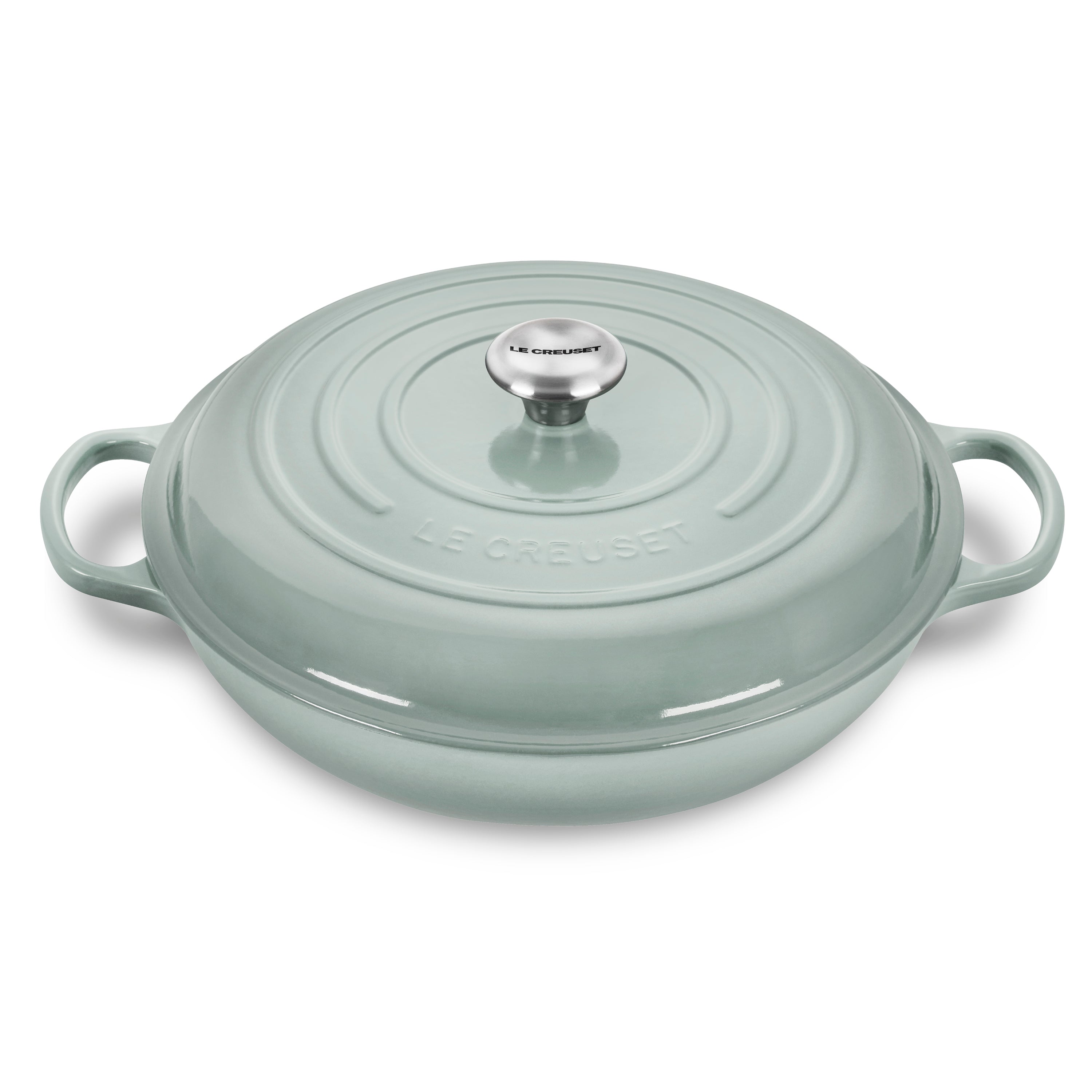 Le Creuset Sea Salt cast iron braiser with lid on stove for even heat distribution
