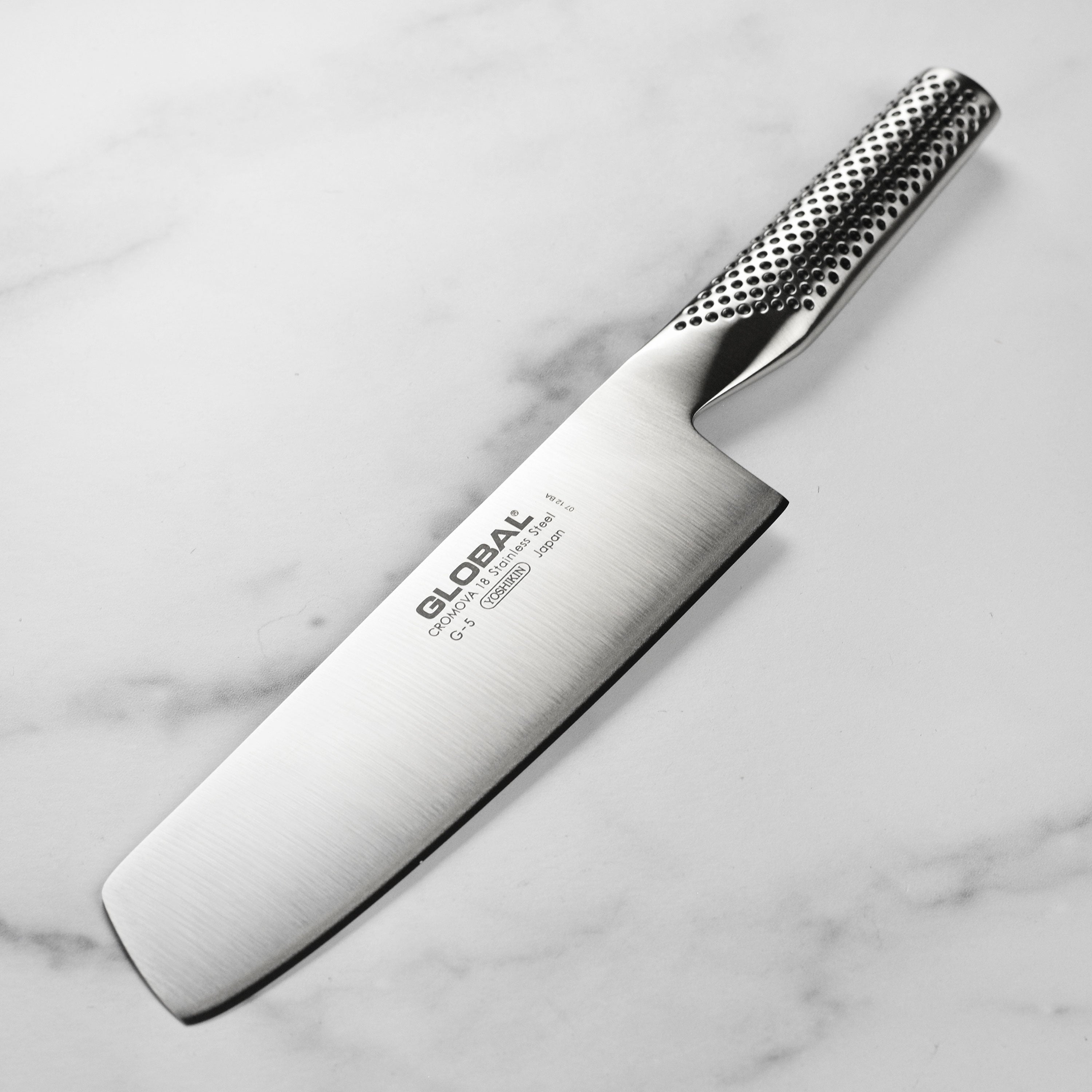 Close-up of the Premium Japanese Nakiri knife showcasing the razor-sharp blade and ergonomic handle.