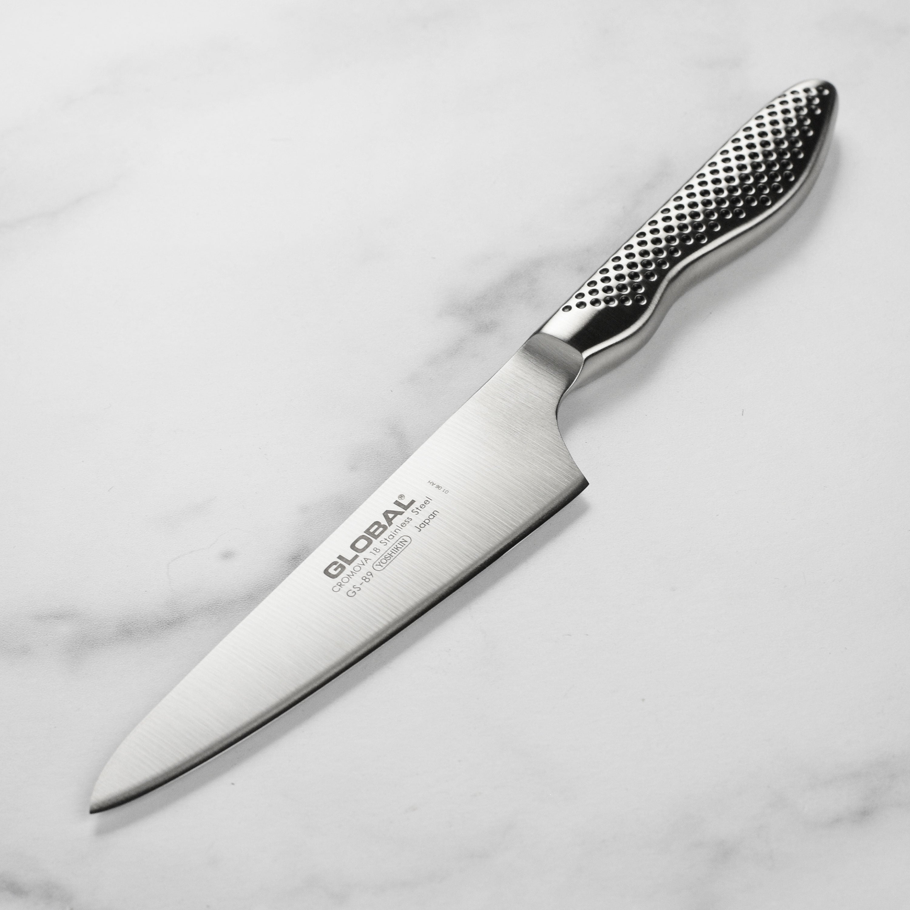 Close-up of the high carbon stainless steel blade of the chef's prep knife showing sharp edge