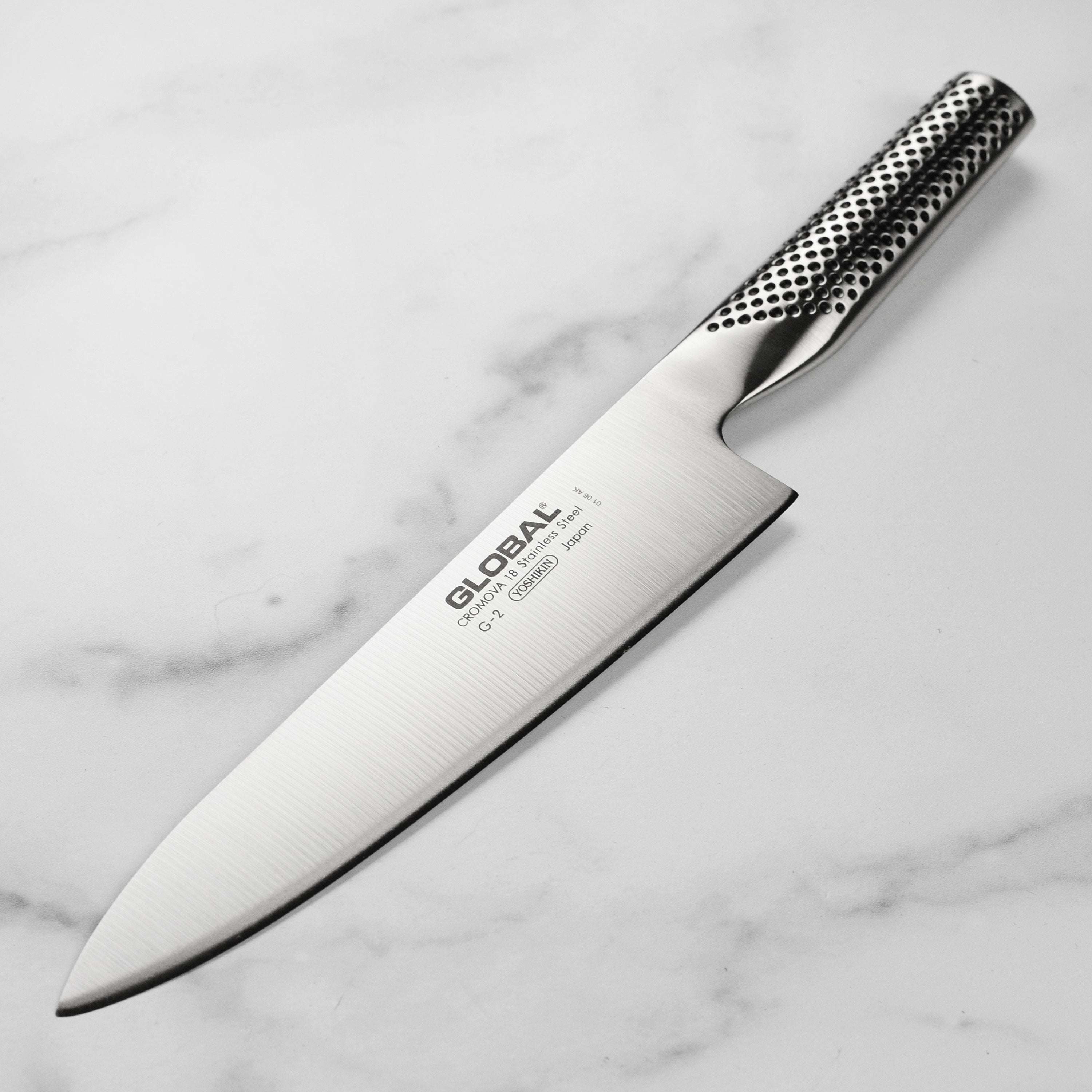 Global 8-inch chef's knife with ergonomic handle, close-up of blade