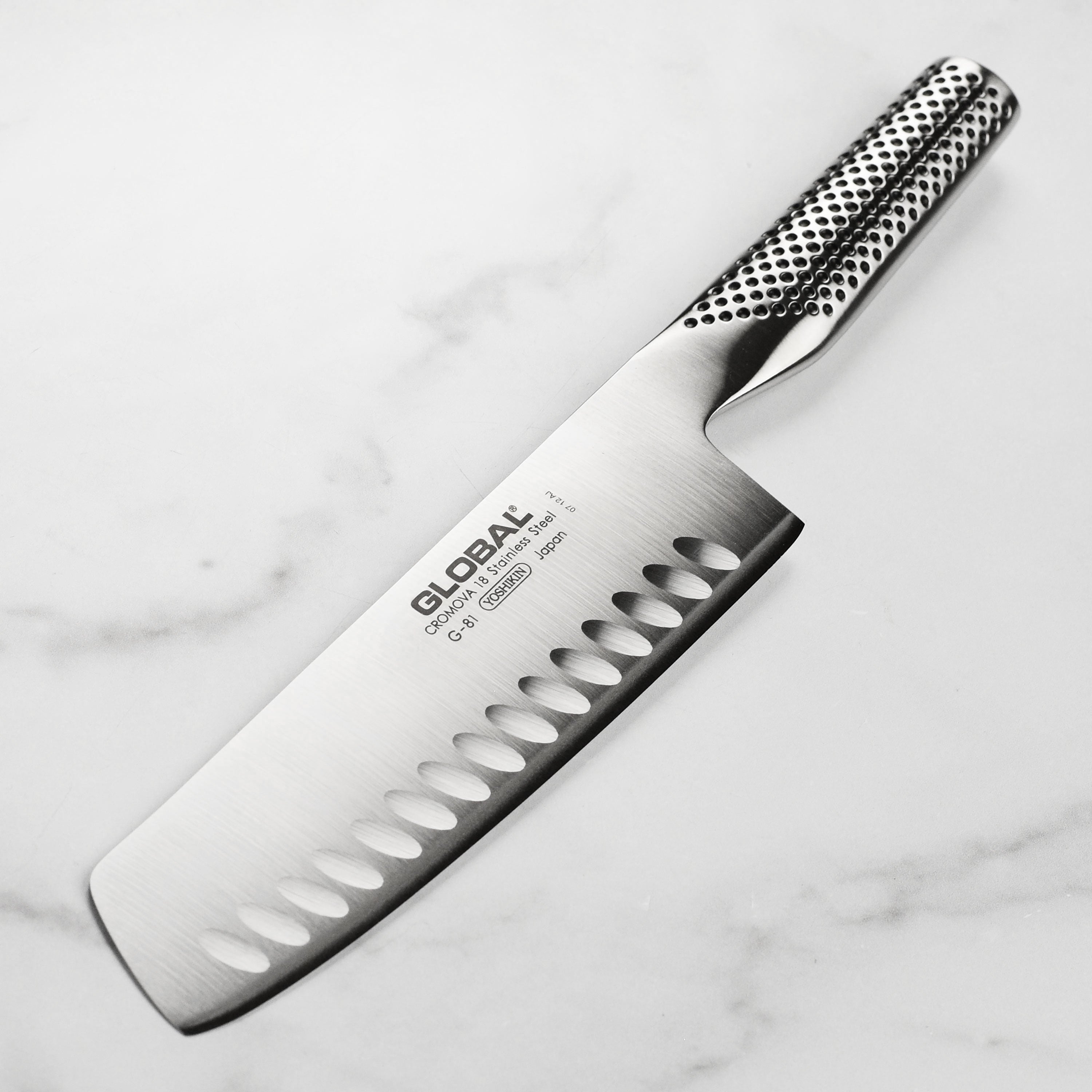 Close-up of the high carbon stainless steel nakiri knife showcasing its sharp edge and ergonomic handle.