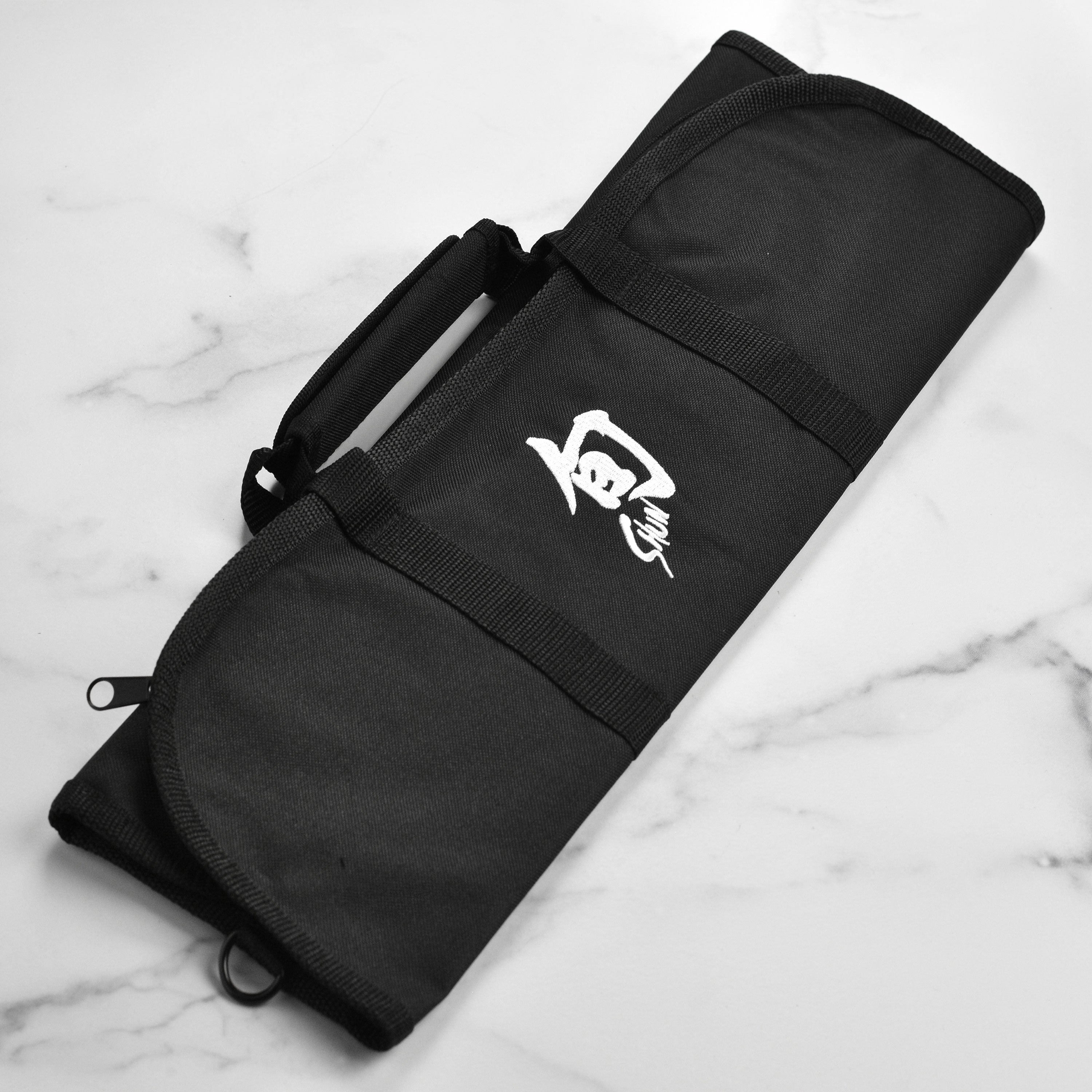 Top view of chef knife bag open with knives organized in 8 slots