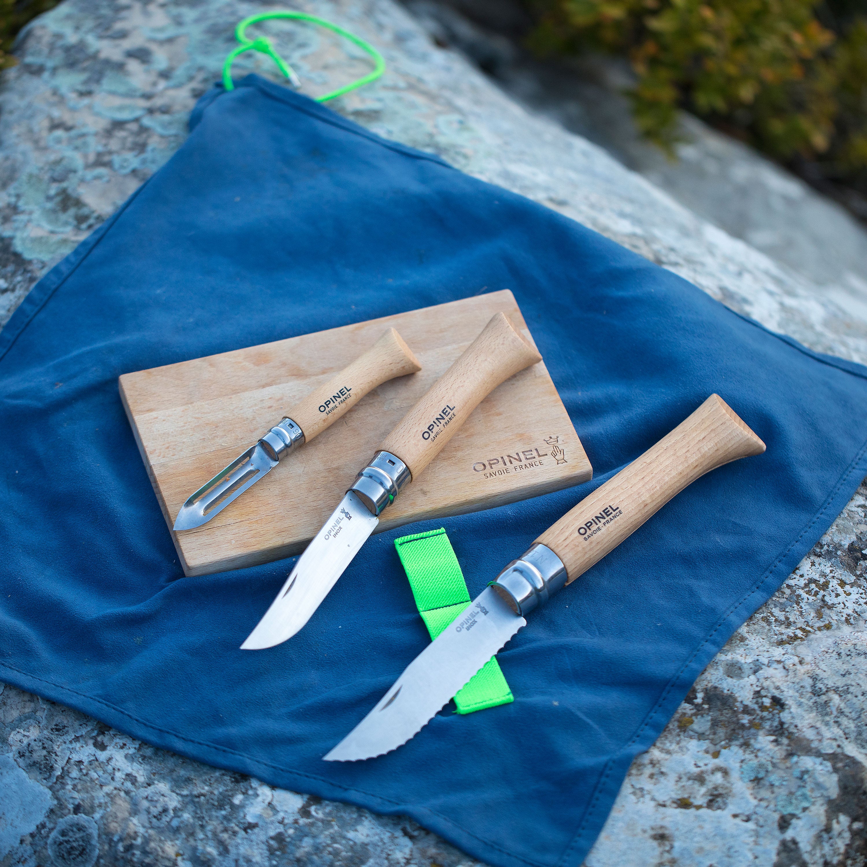 Close-up of the Nomad Pro camping knife showcasing its stainless steel blade and beech wood handle.