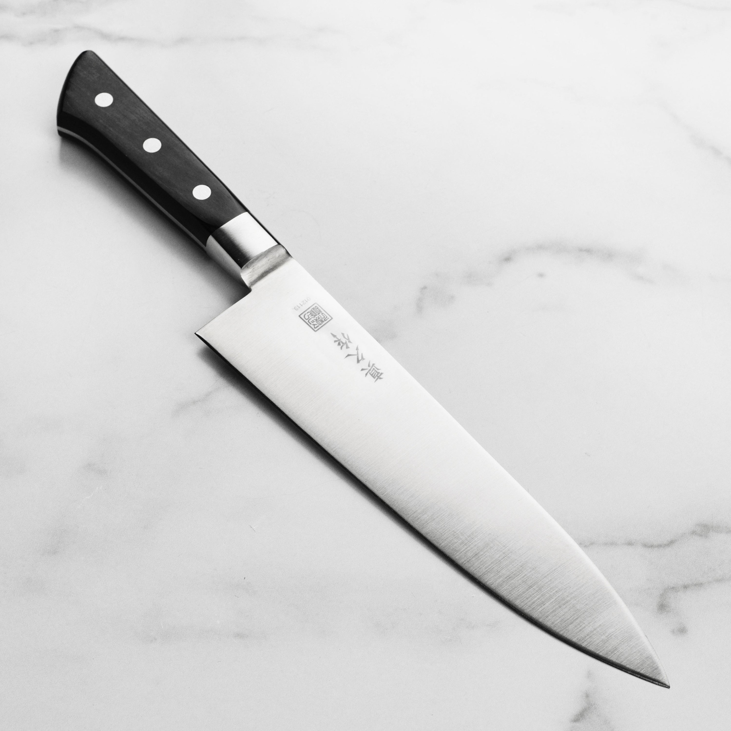 MAC professional 8.5-inch chef's knife with a sharp blade and ergonomic handle