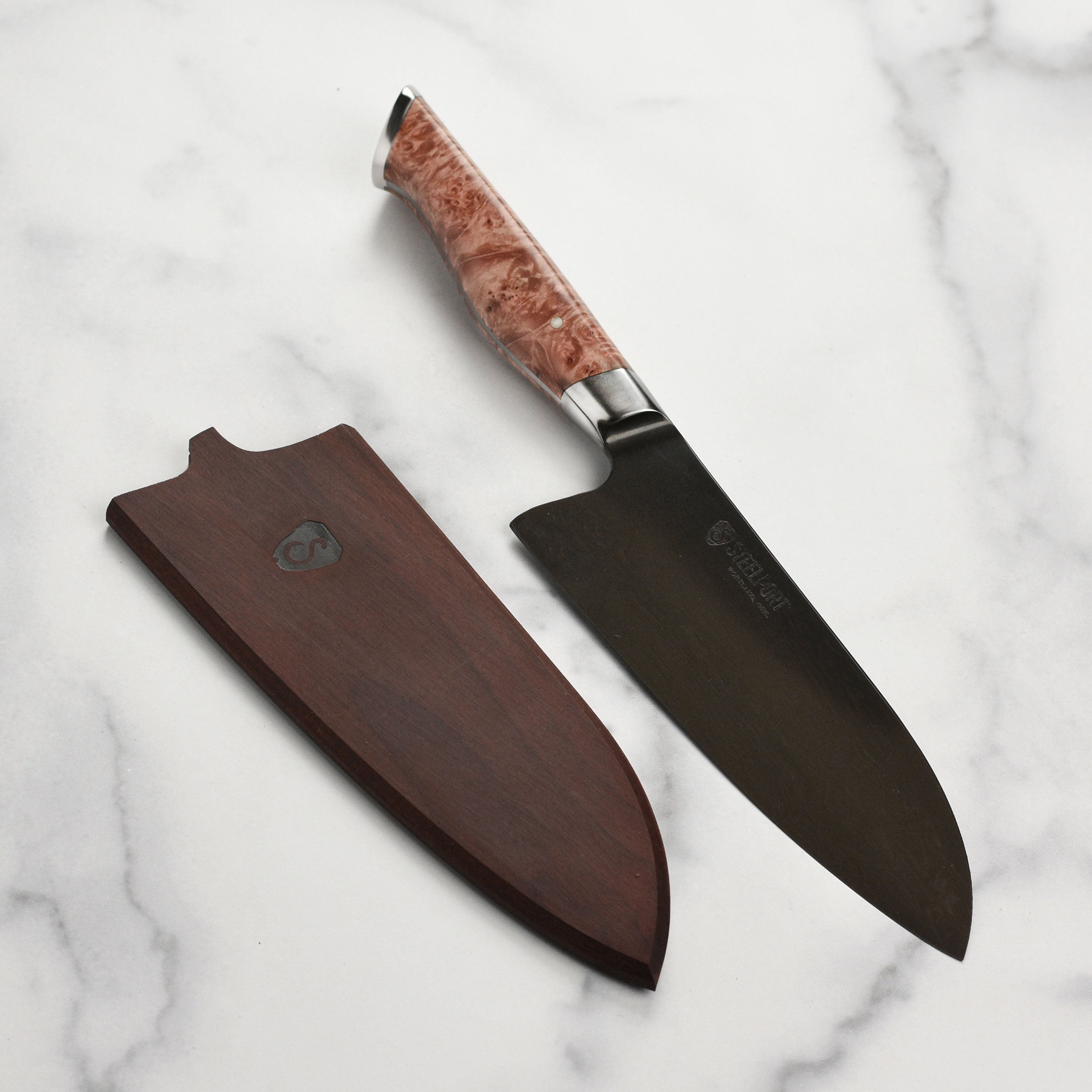 Steelport chef knife with wooden handle and sharp blade from a top view.