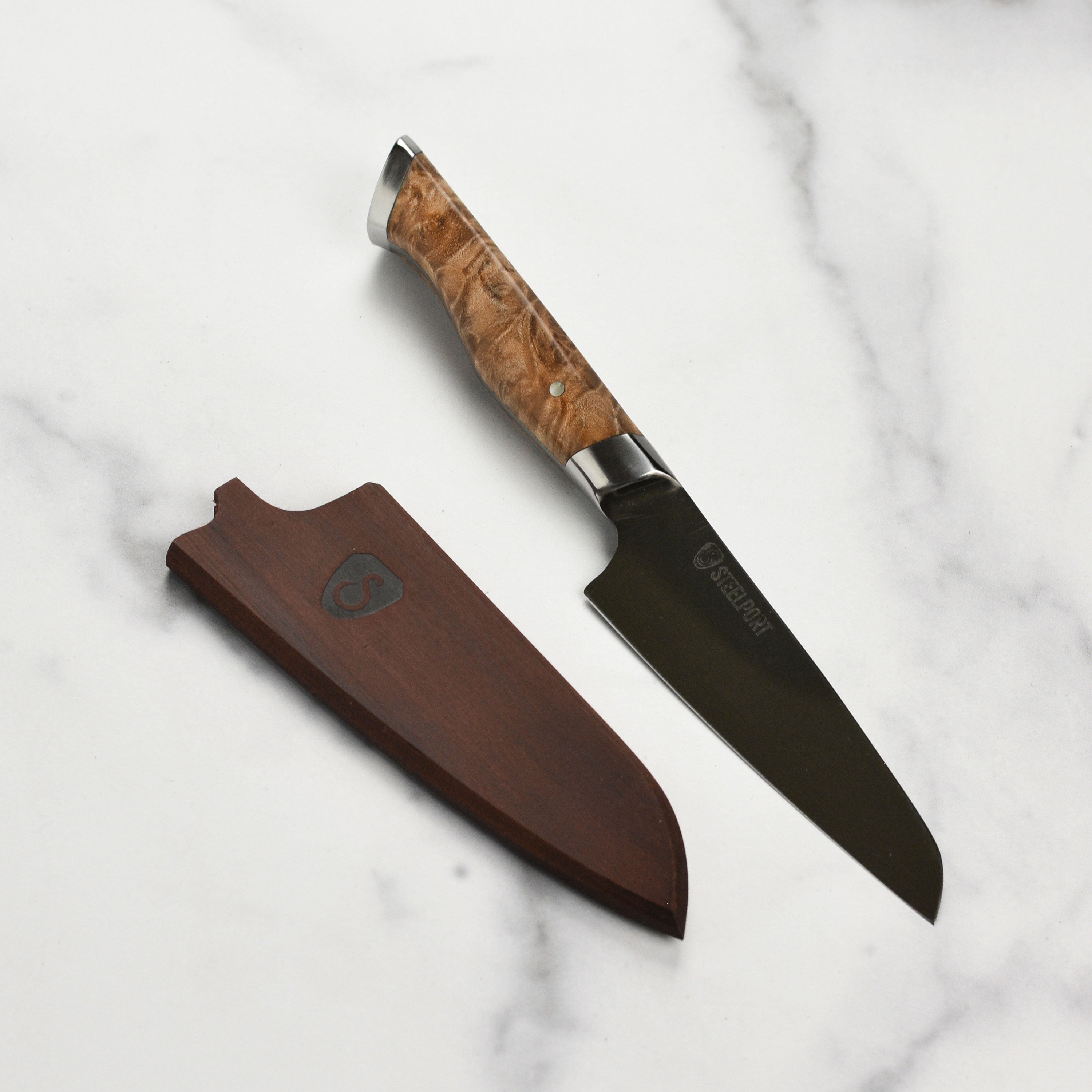 Steelport carbon steel paring knife with Oregon maple sheath, angled view showing blade and handle.