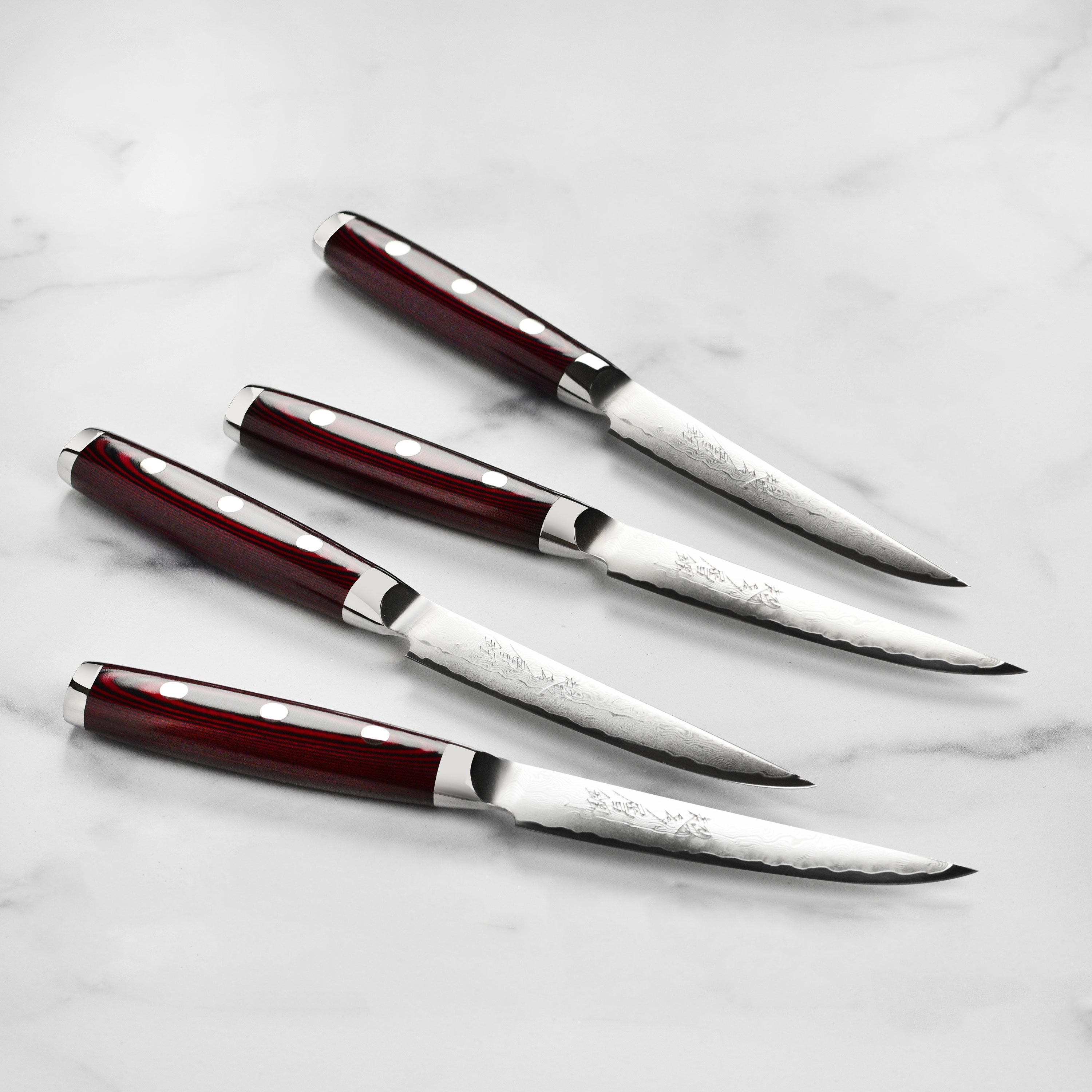Close-up of Yaxell Super Gou steak knife blade showcasing its sharpness and craftsmanship.