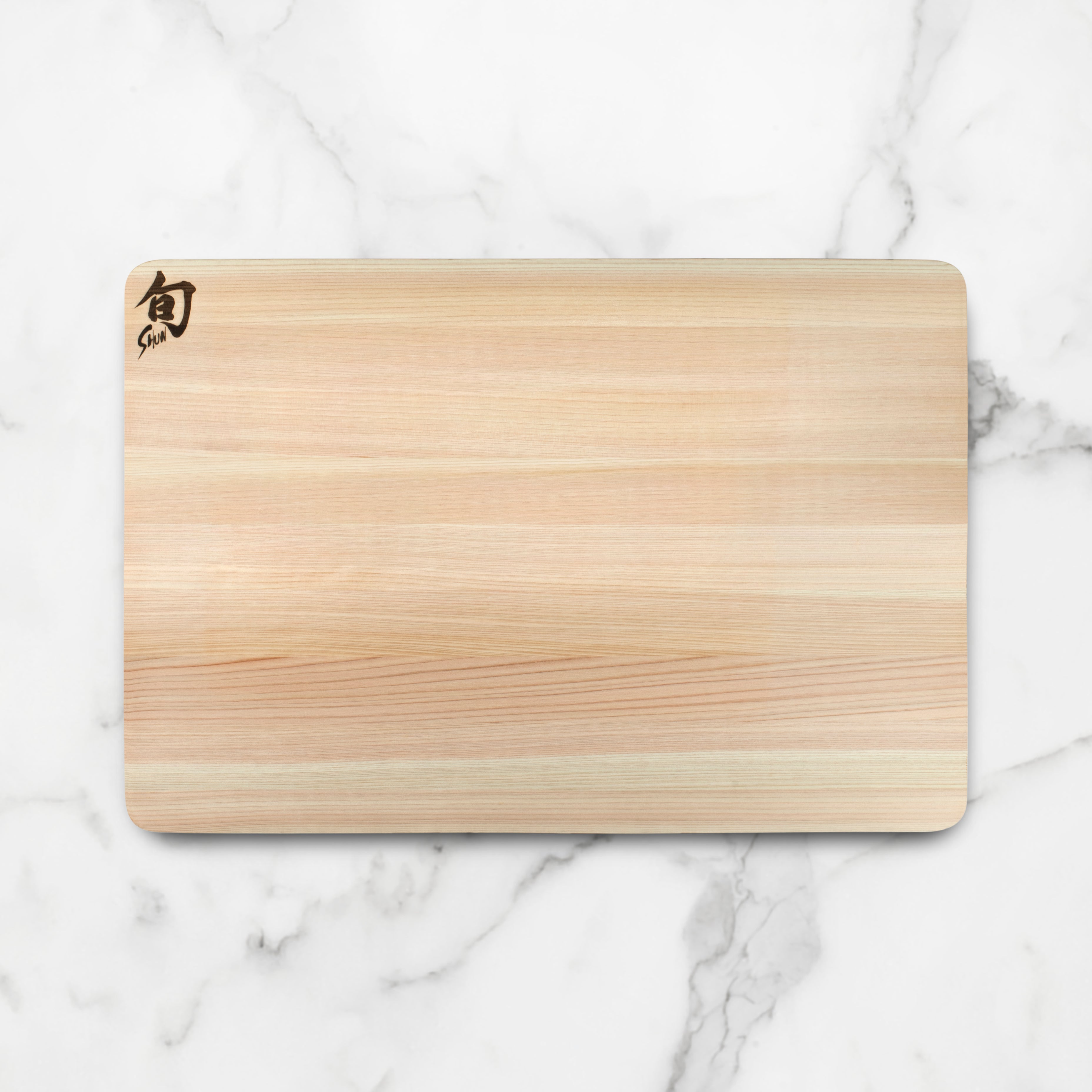 Japanese Hinoki wood cutting board with a knife and fresh vegetables