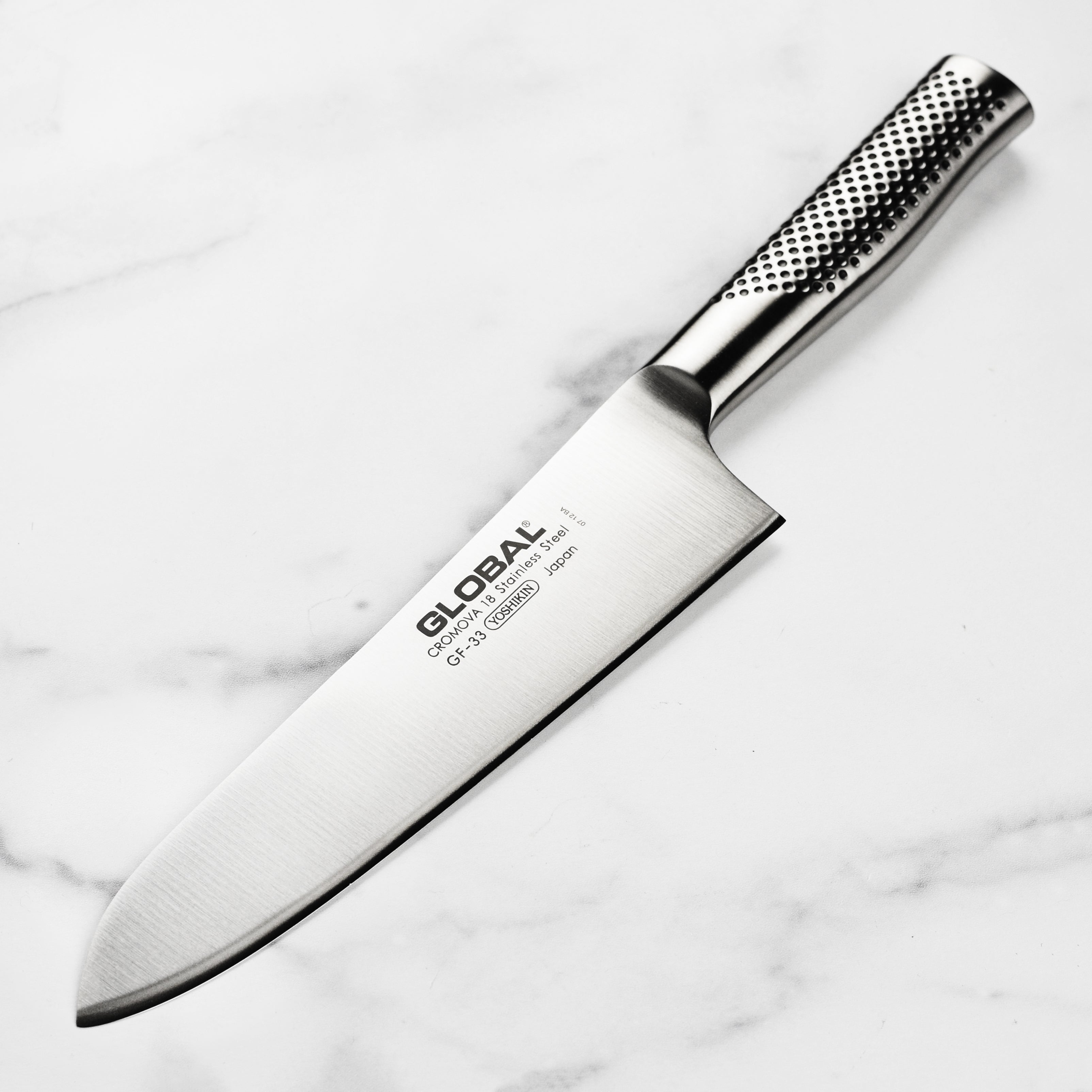 Global heavyweight chef's knife with ergonomic handle and sharp blade for professional chefs