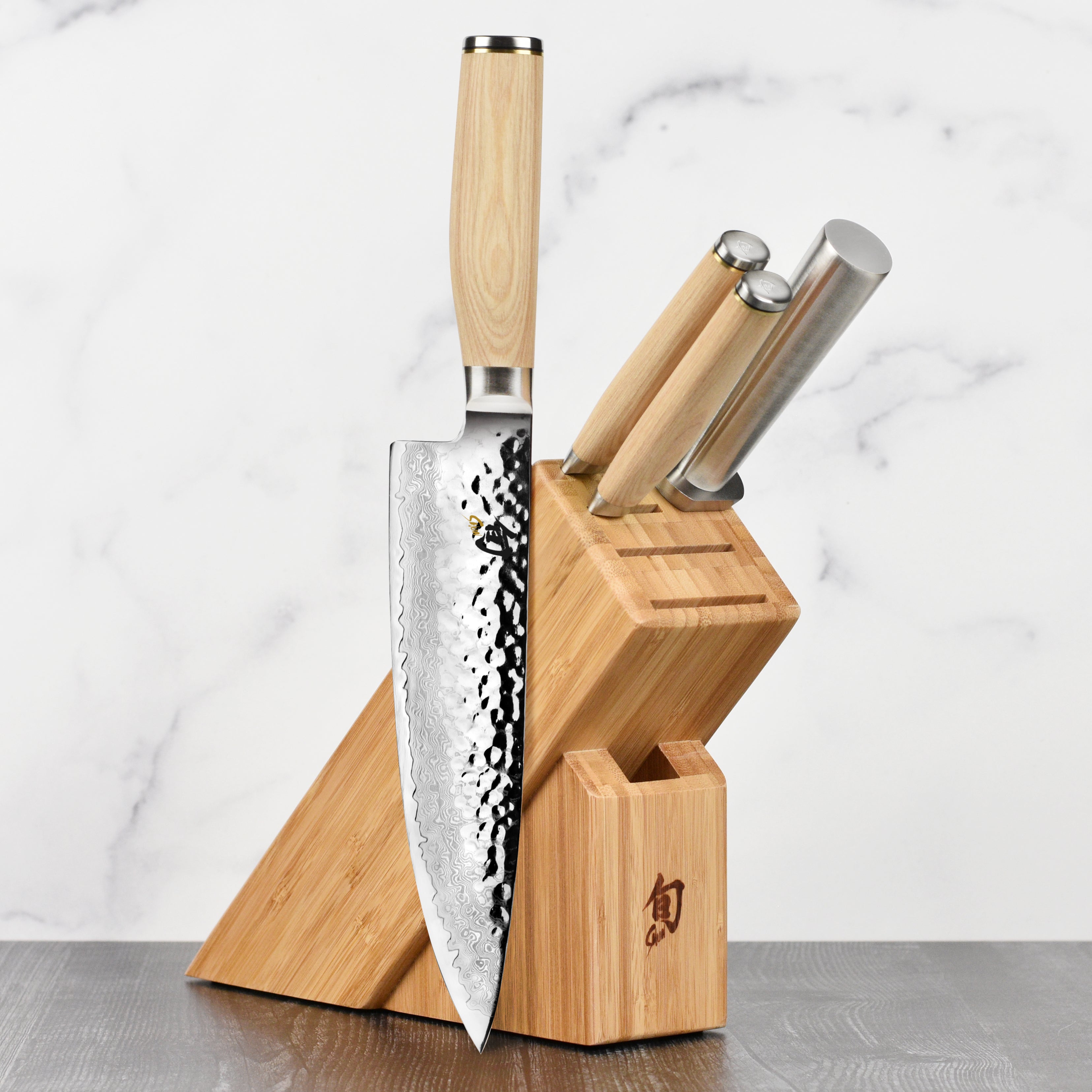 Close-up of Shun Premier Blonde knife set displaying the blades and handles.