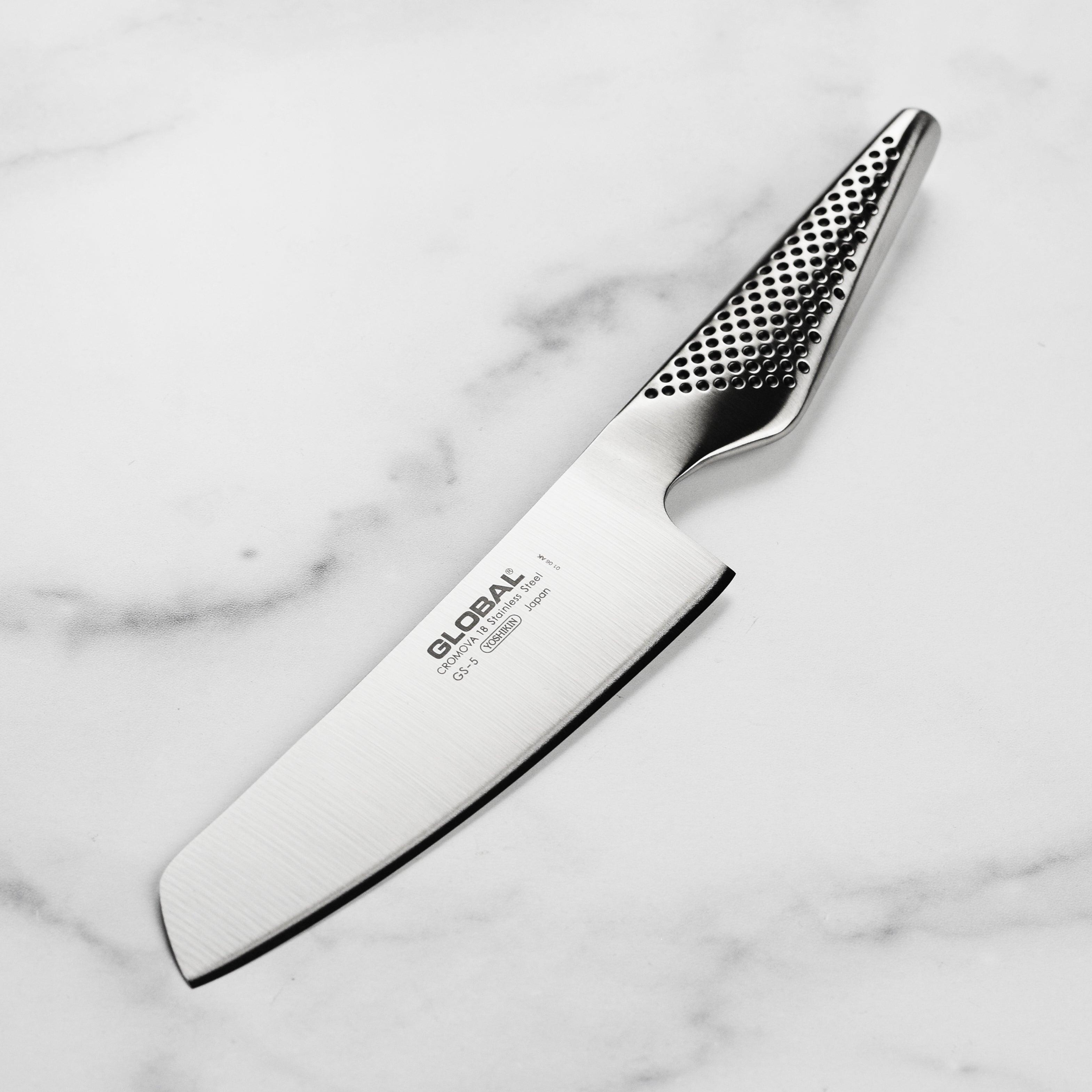 Close-up view of the Premium Japanese Nakiri Knife's sharp edge and ergonomic handle.