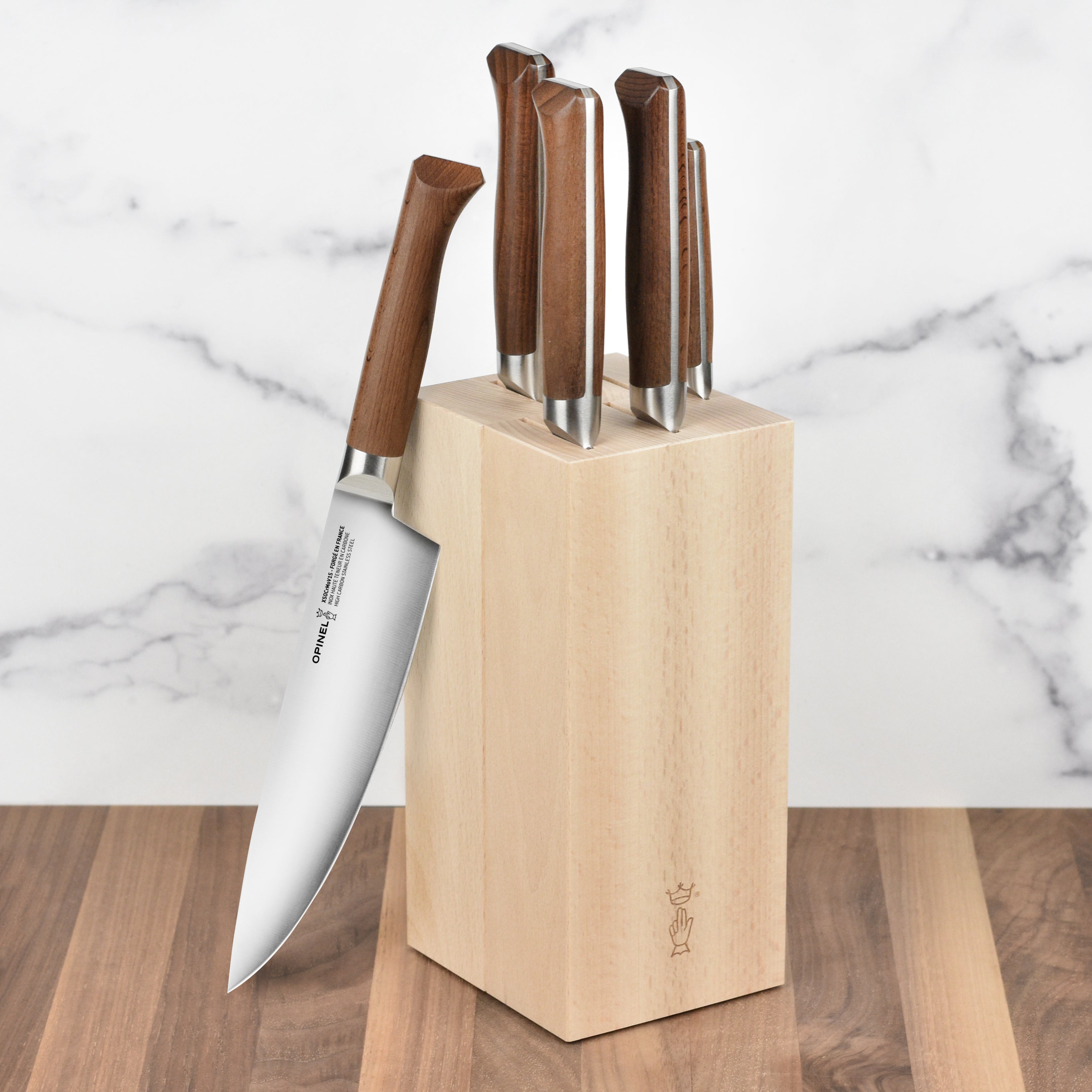 Opinel 1890 6-Piece Chef Knife Block Set displayed on a kitchen counter, highlighting the elegant design and quality.