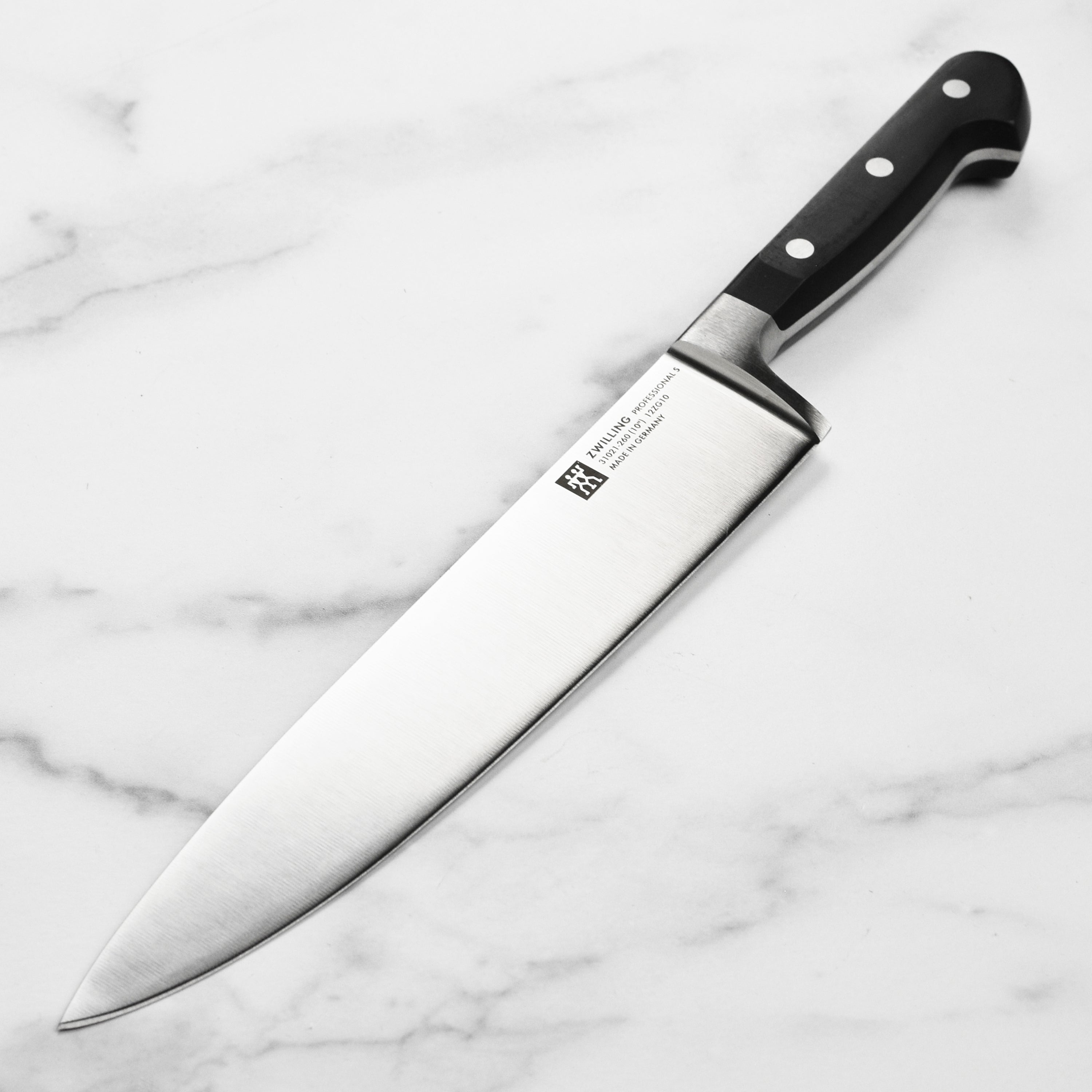 Side view of Zwilling Pro 10-Inch Chef's Knife showcasing its sleek blade and ergonomic handle