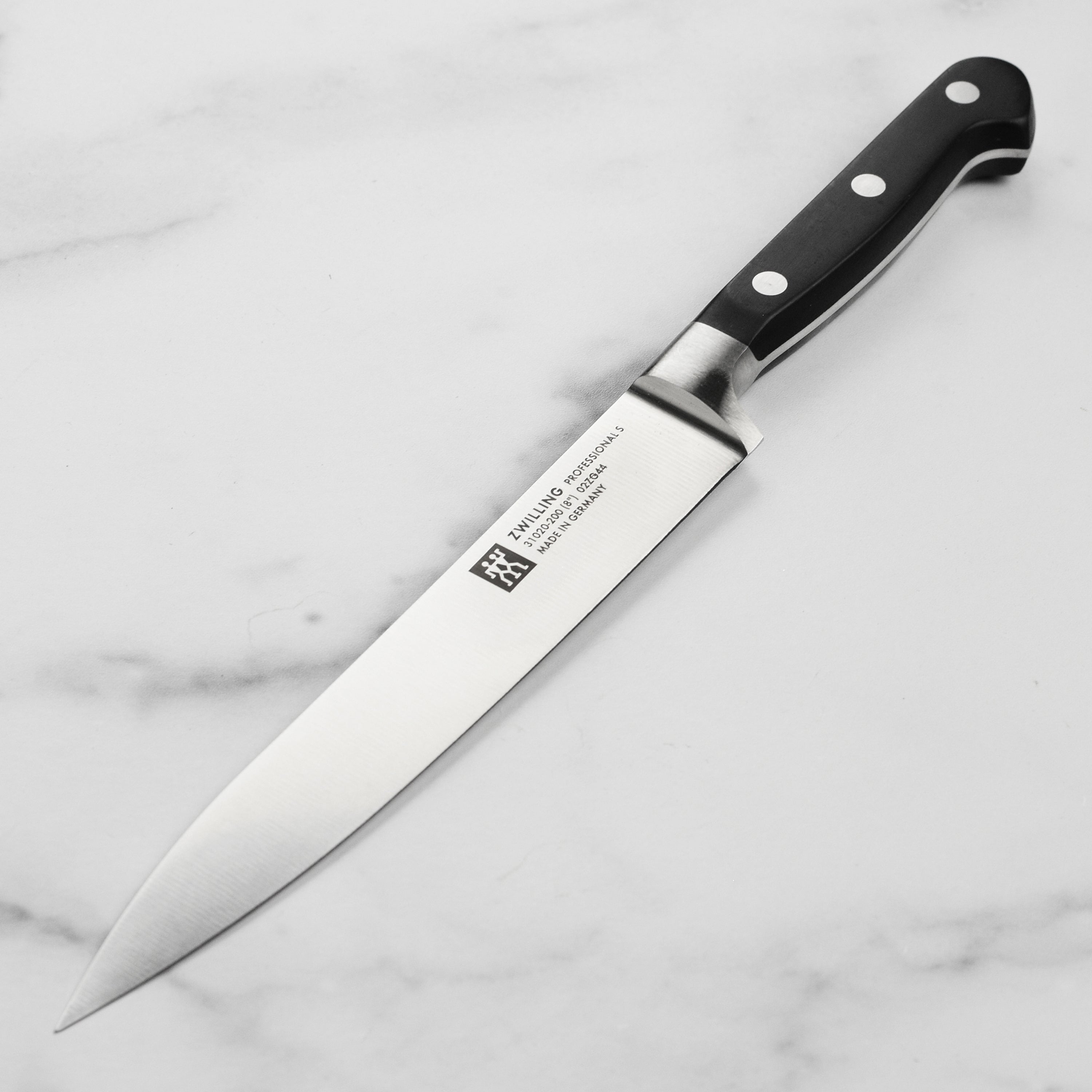 Close-up of Zwilling Premium 8-Inch Carving Knife showcasing the sharp blade.