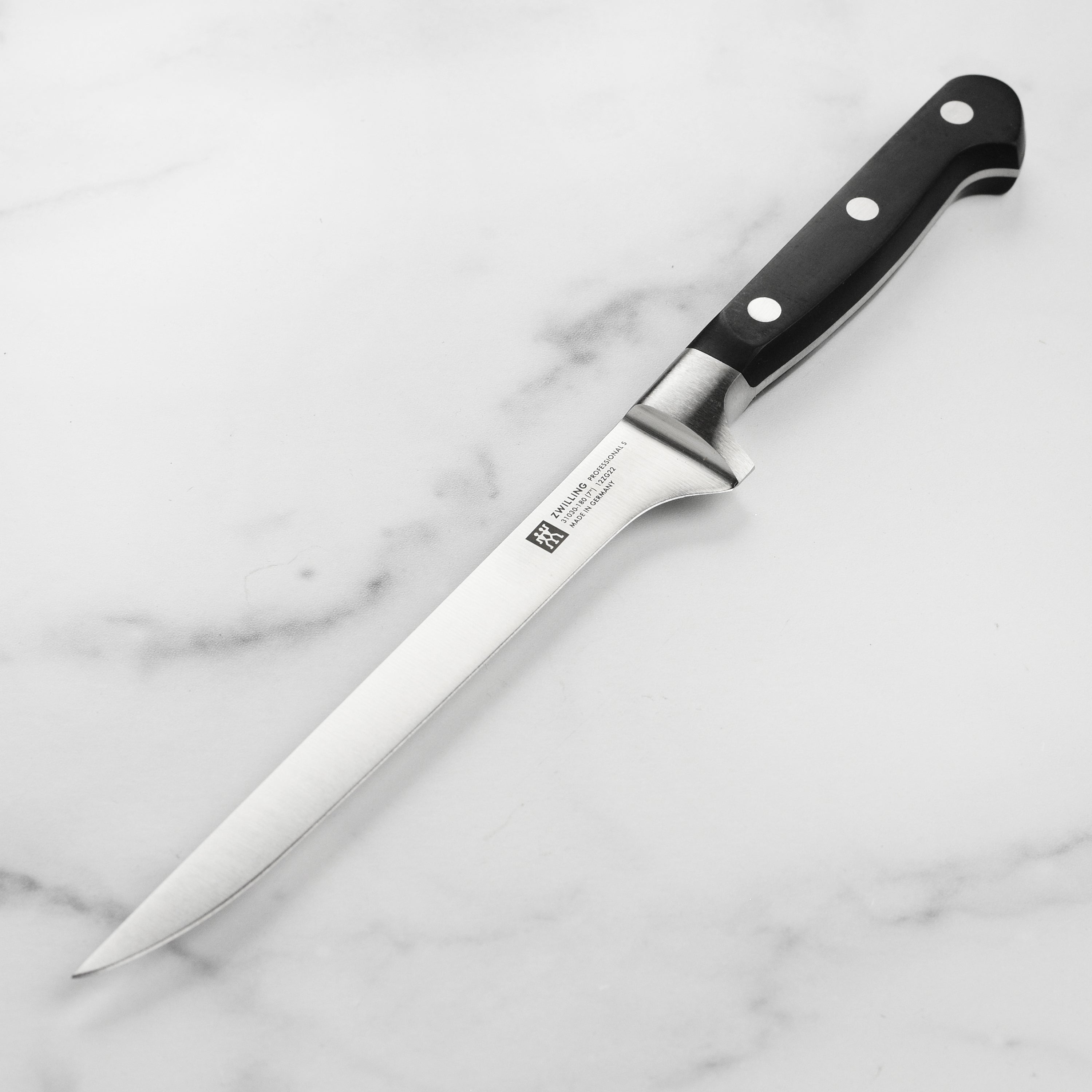 Zwilling Professional 7-Inch Fillet Knife angled view, highlighting the blade and handle comfort.