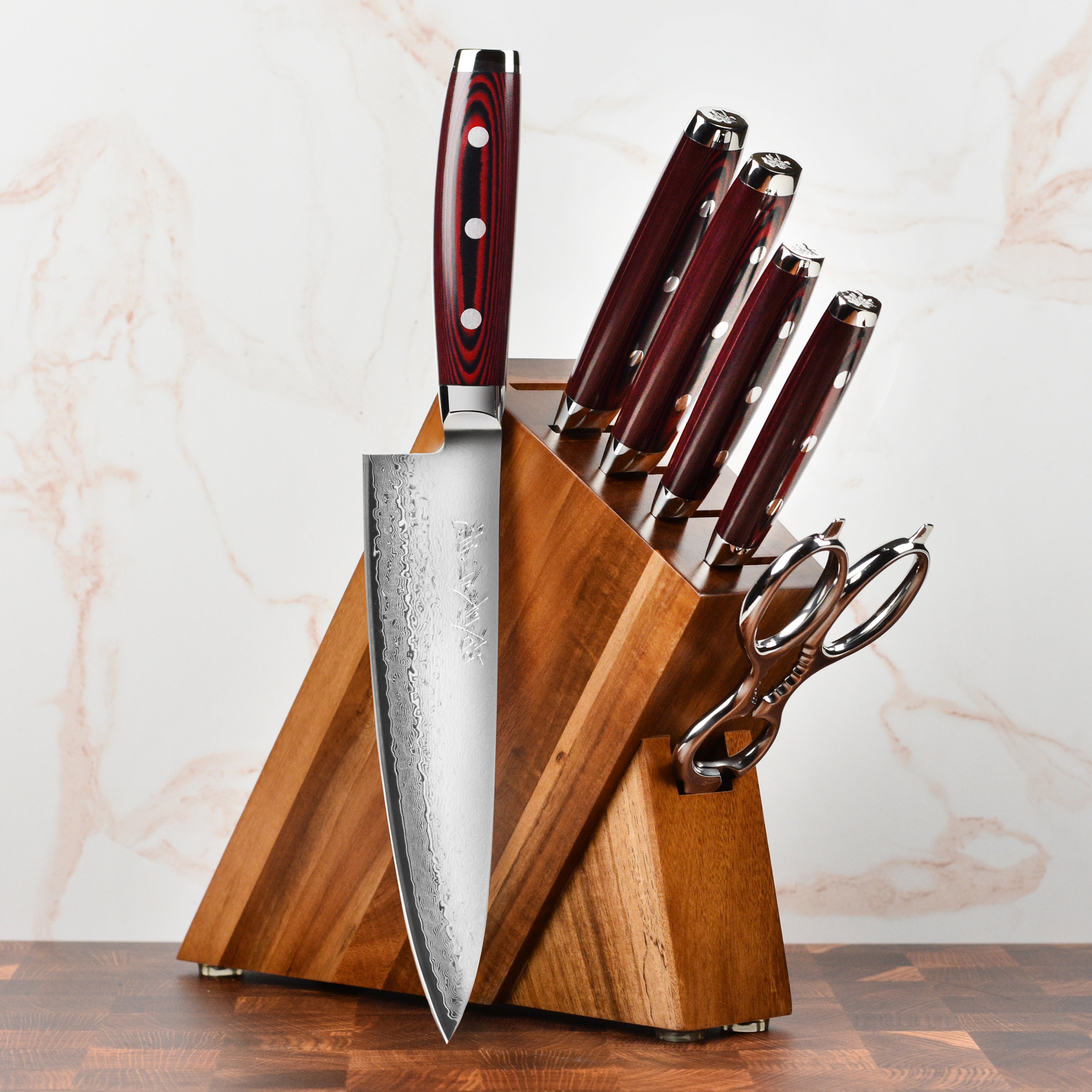 Yaxell Super Gou Japanese chef knives with acacia block on kitchen counter