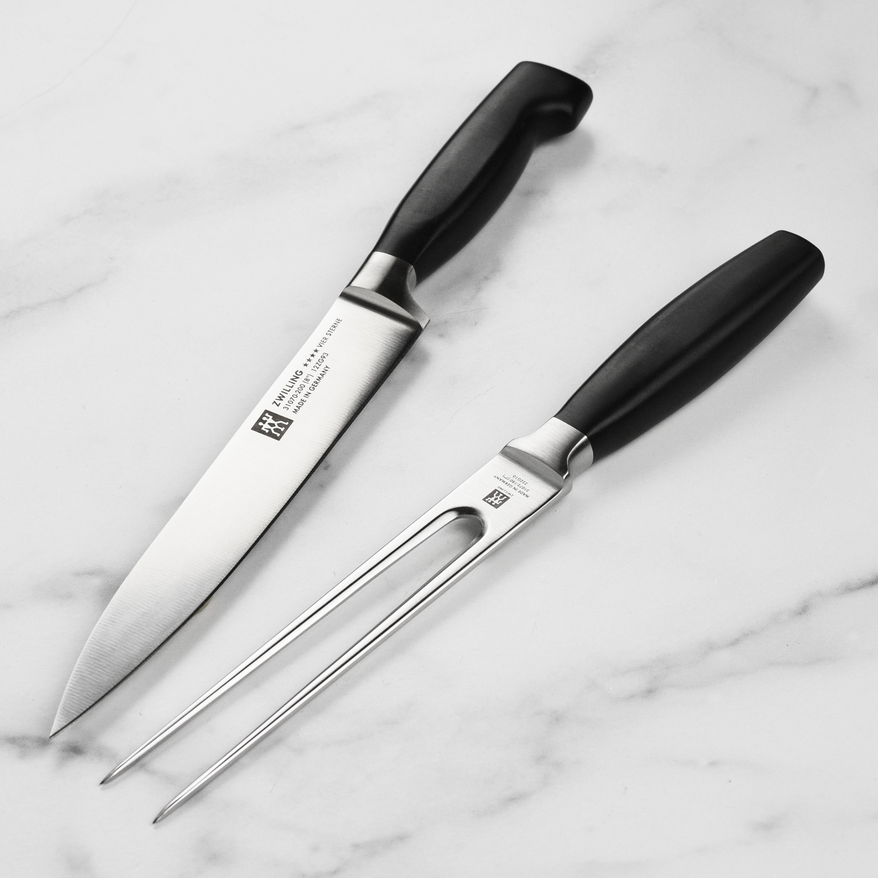 Close-up of the Zwilling Four Star slicing knife highlighting the precision edge and comfortable grip.