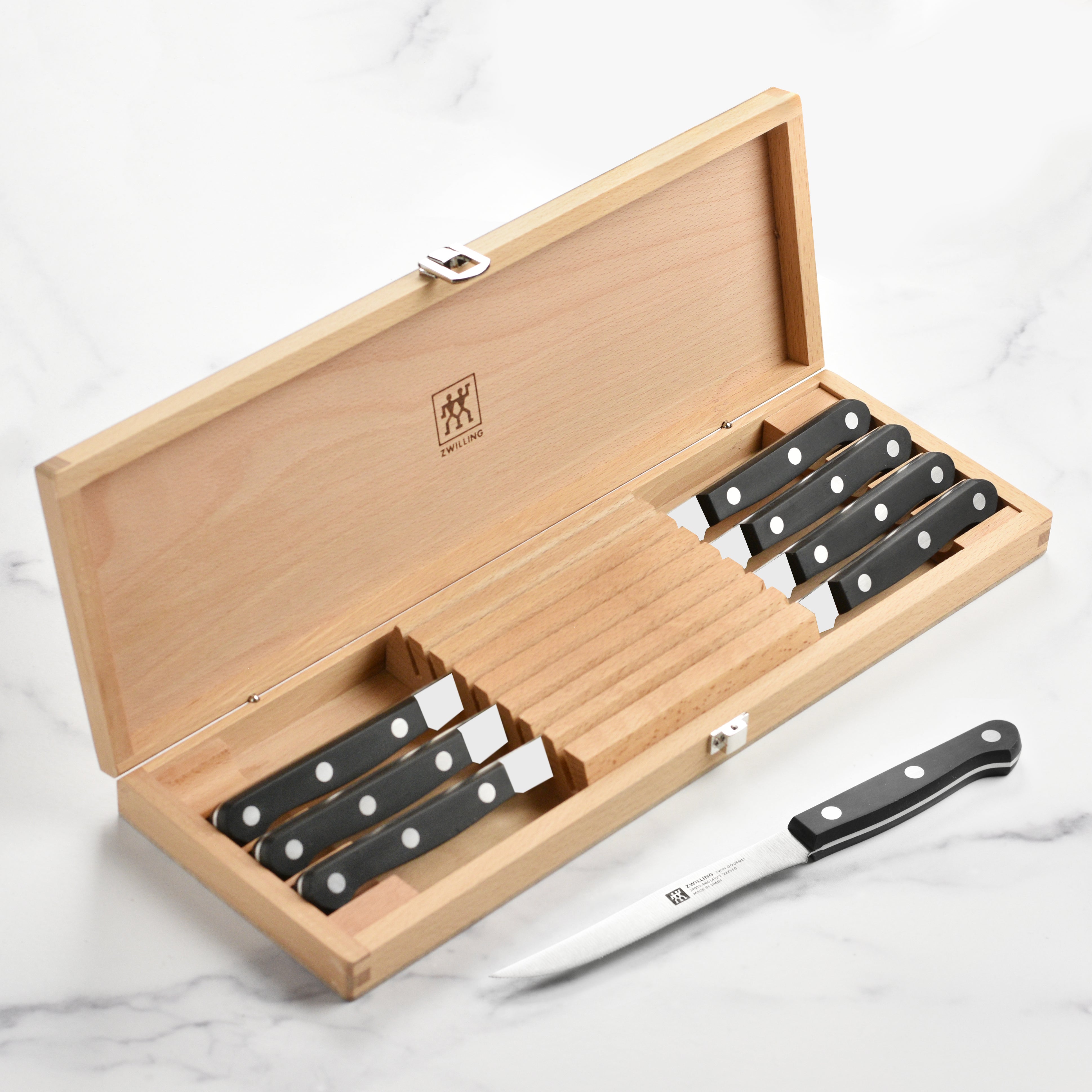 Close-up of the Gourmet Chef's steak knife set showcasing sharp blades and ergonomic handles.
