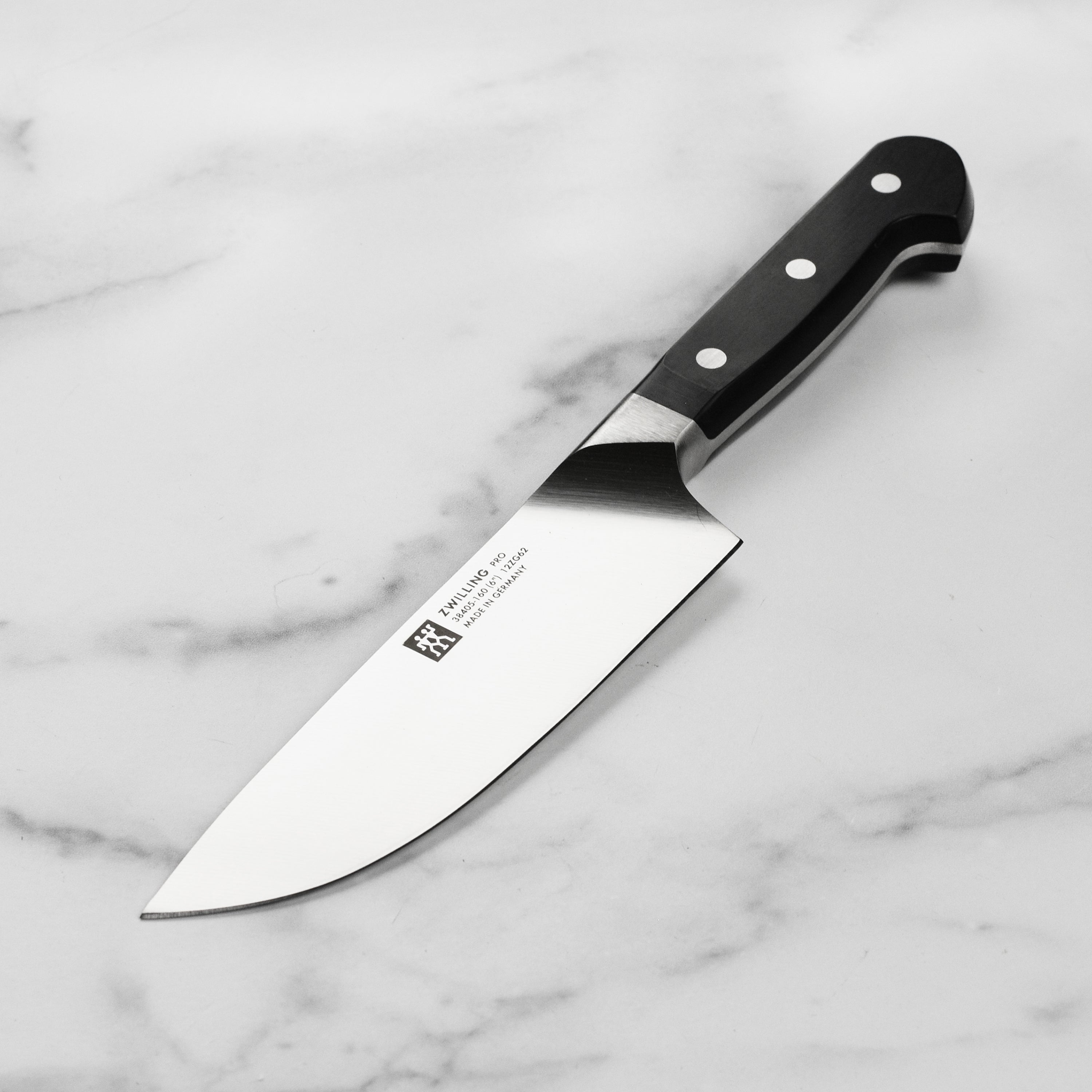 Close-up of Zwilling Pro 6-inch chef's knife blade showing precision edge