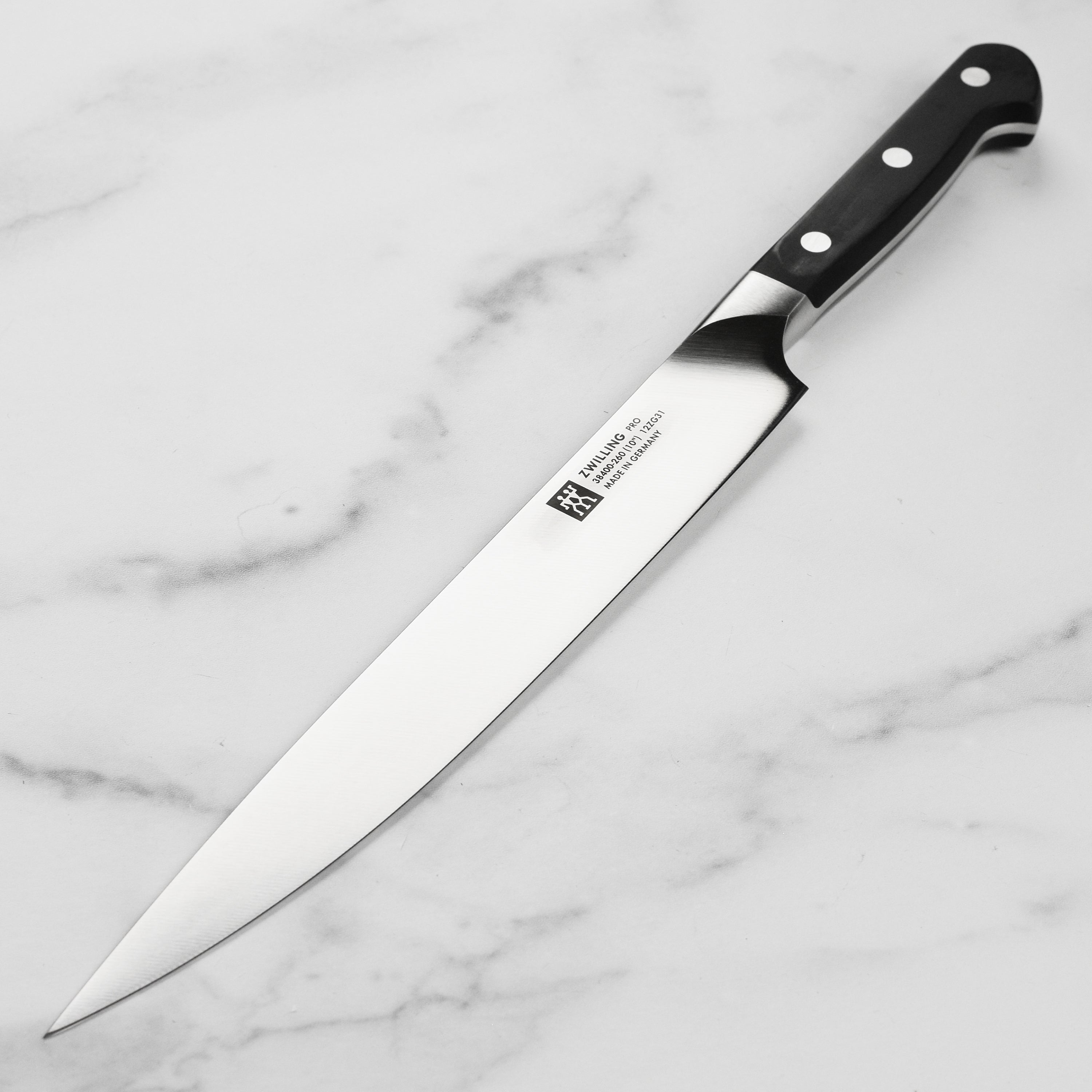 Close-up of Zwilling Pro 10-inch slicing knife blade with high carbon steel finish