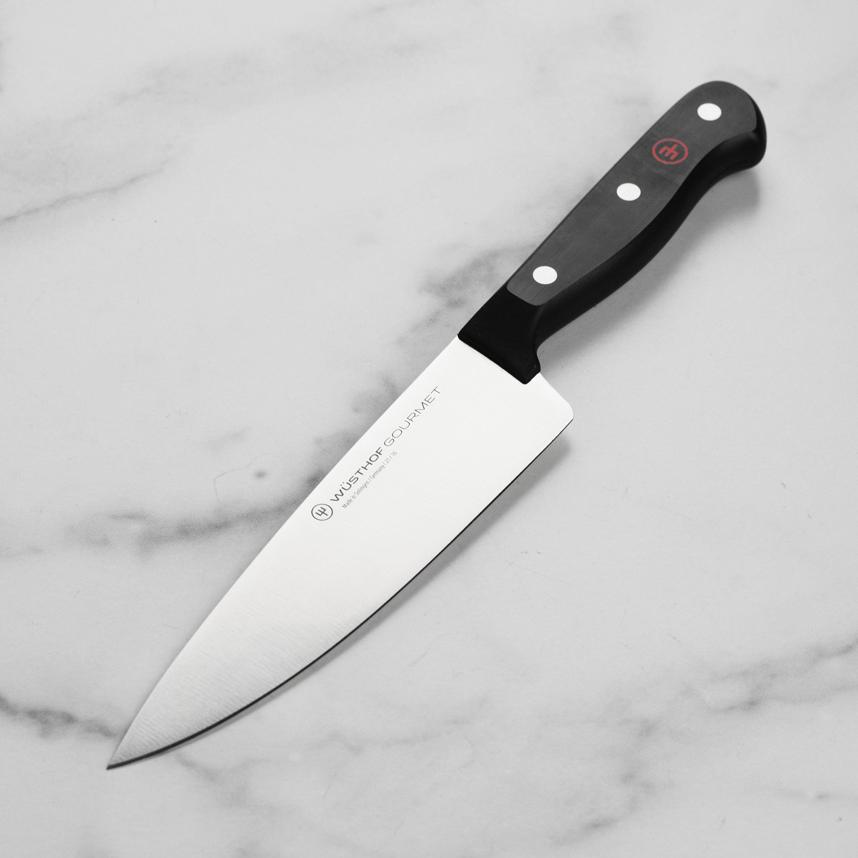 Wusthof Gourmet 6-Inch Chef's Knife showcasing the high-carbon stainless steel blade and ergonomic handle.