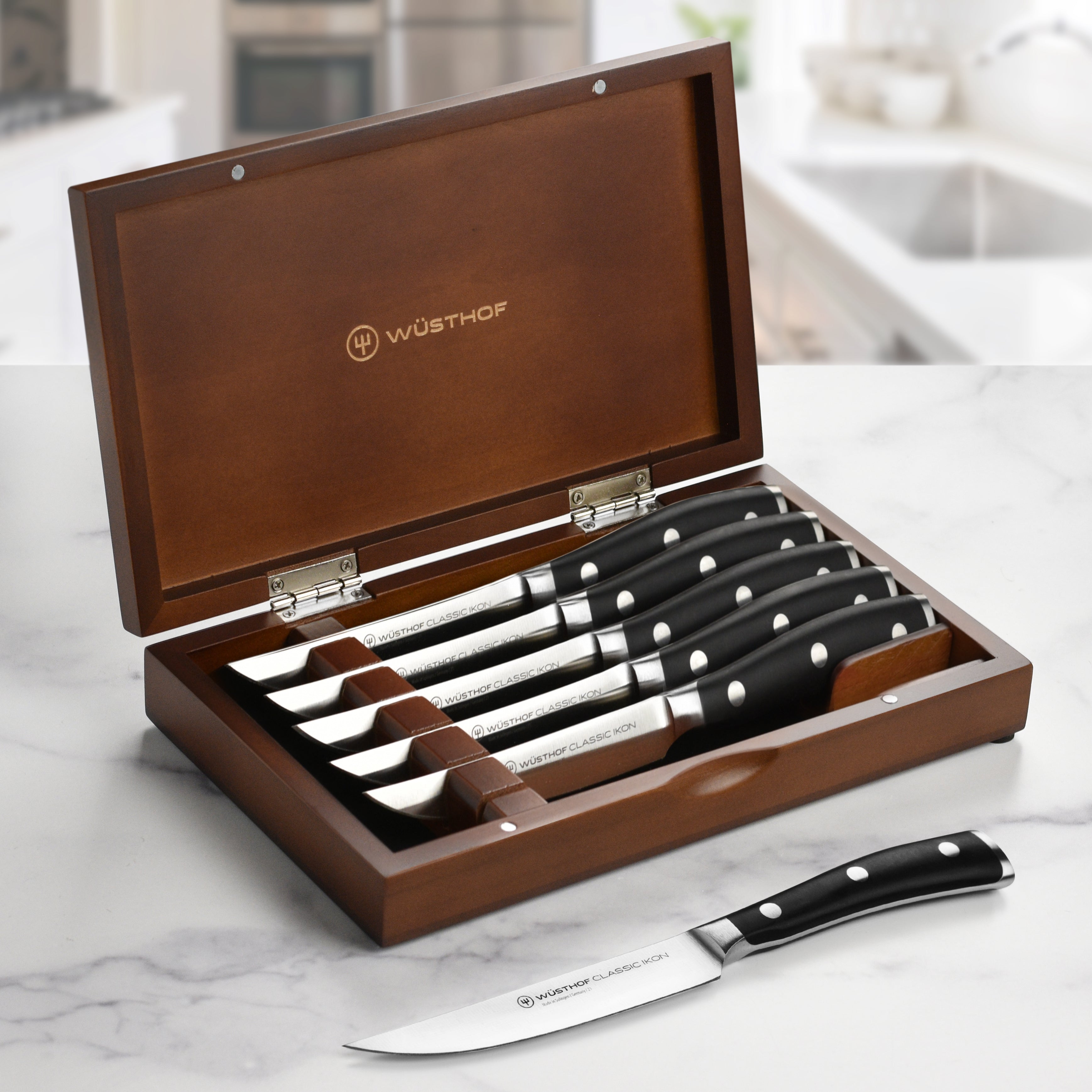 Wusthof Classic Ikon steak knives with wooden case on dining table