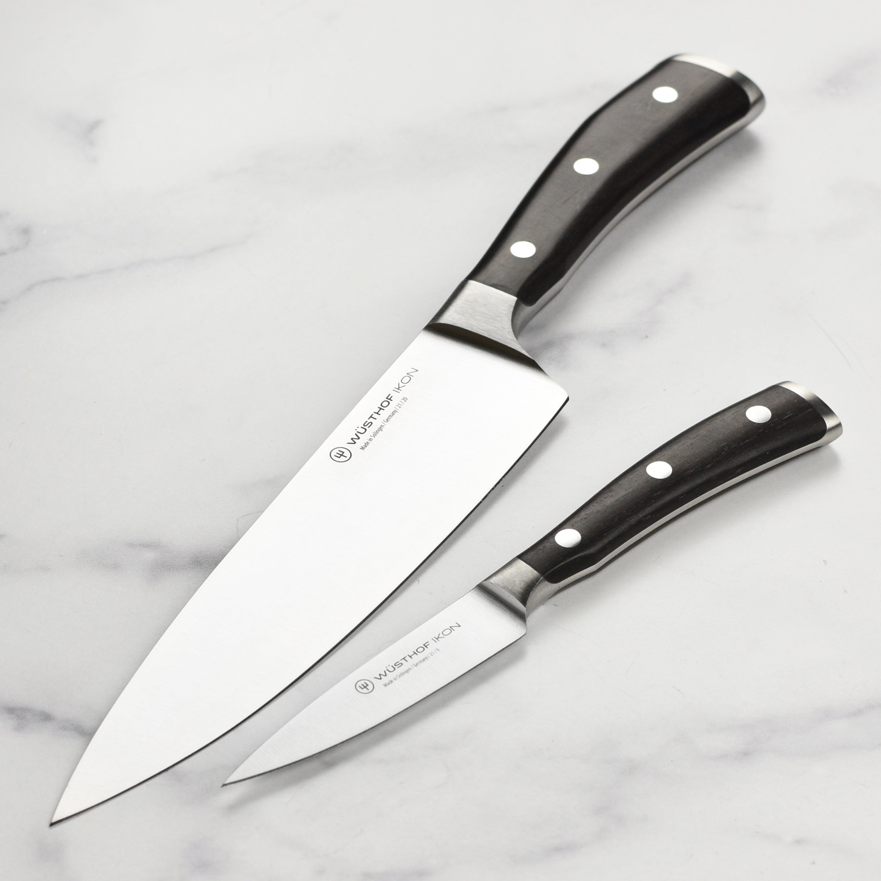 Close-up view of the Wusthof 8-inch chef's knife demonstrating its sharp blade and ergonomic handle.