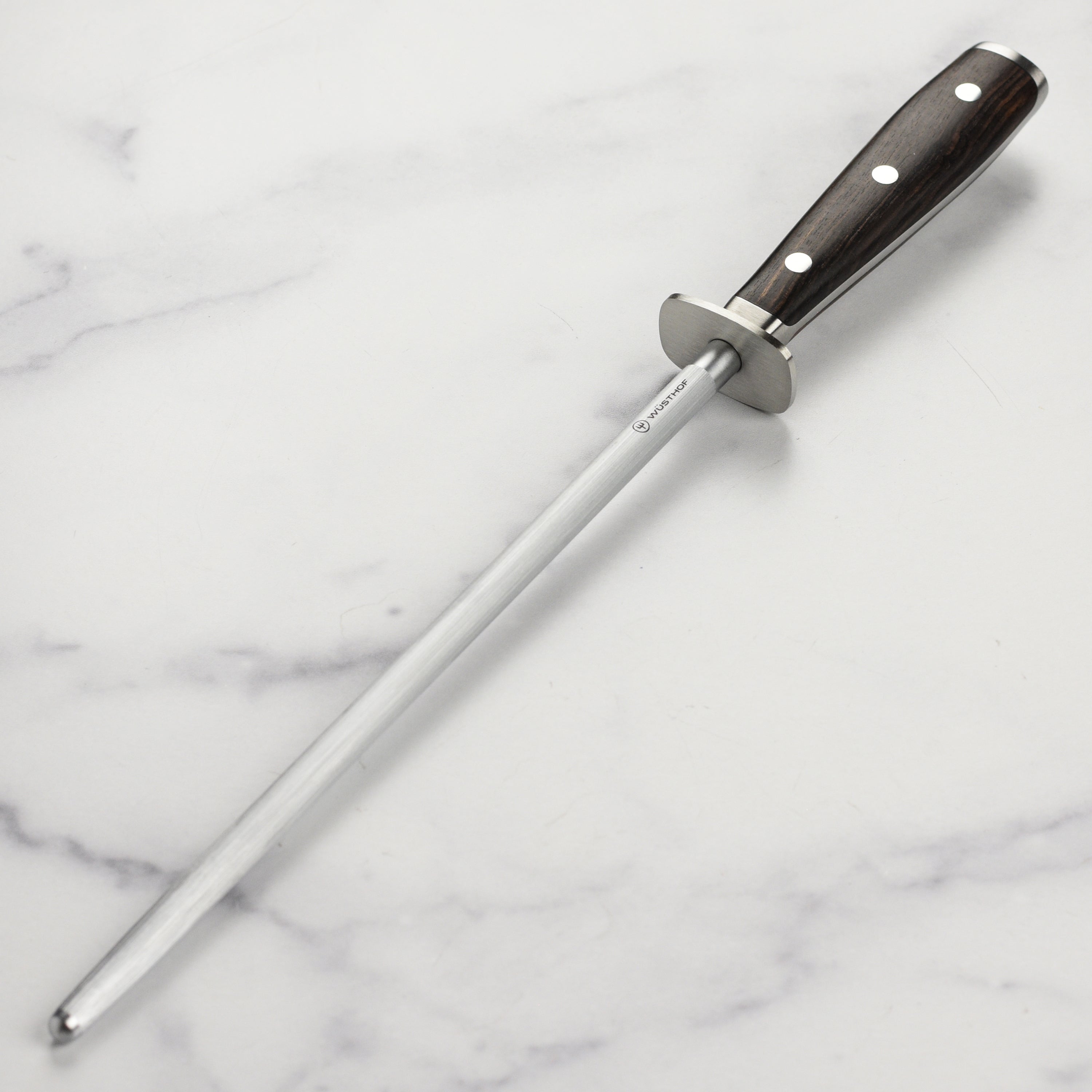 Wusthof Ikon honing steel showcasing the blackwood handle from a side angle for a comfortable grip.